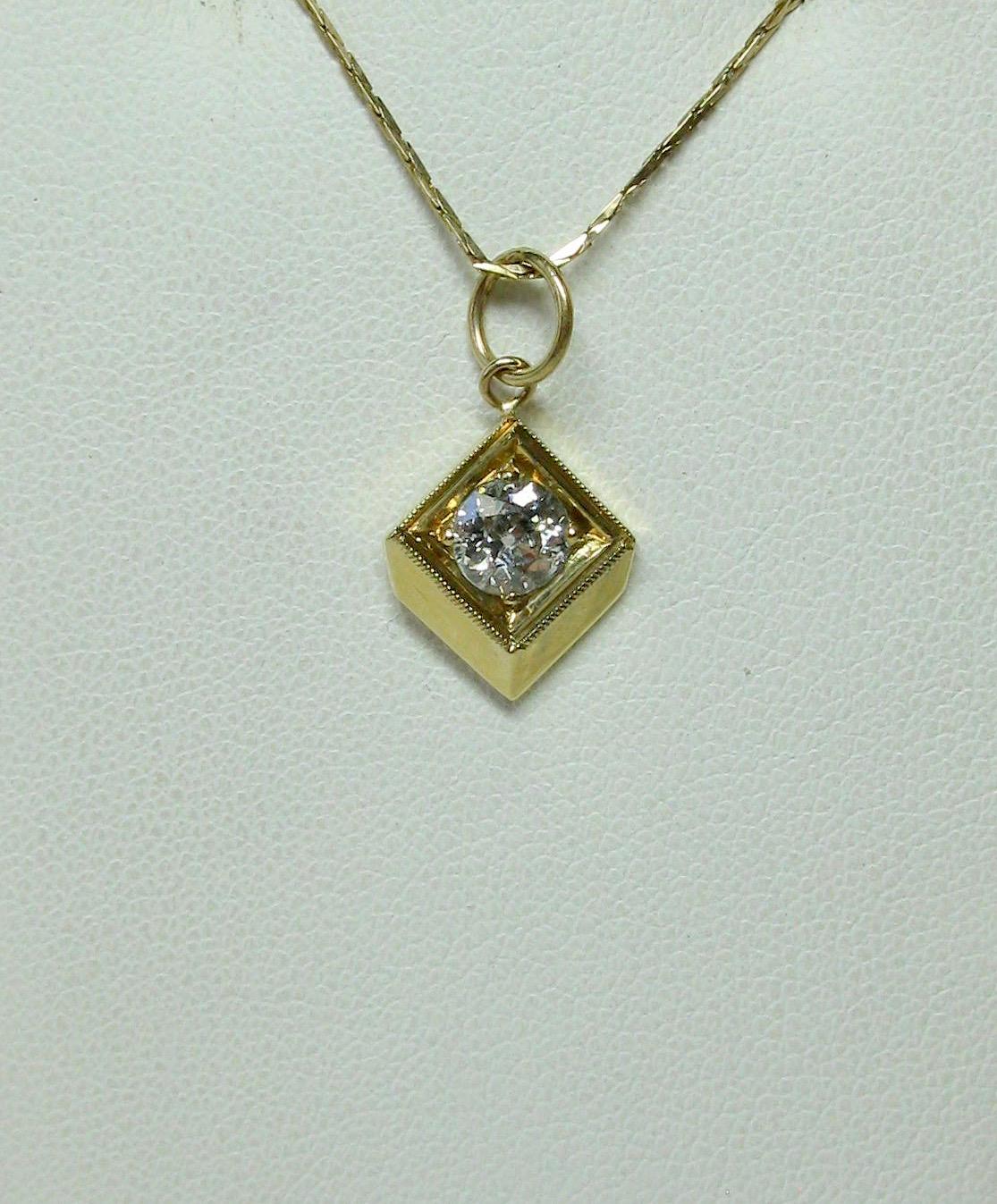 A stunning Antique Victorian Pendant with a gorgeous Old European Cut Diamond of 1/2 Carat.  The sparkling white antique diamond is I color - very white!  It is set in a beautiful beaded milgrain architectural border in lovely 14 Karat Yellow Gold. 