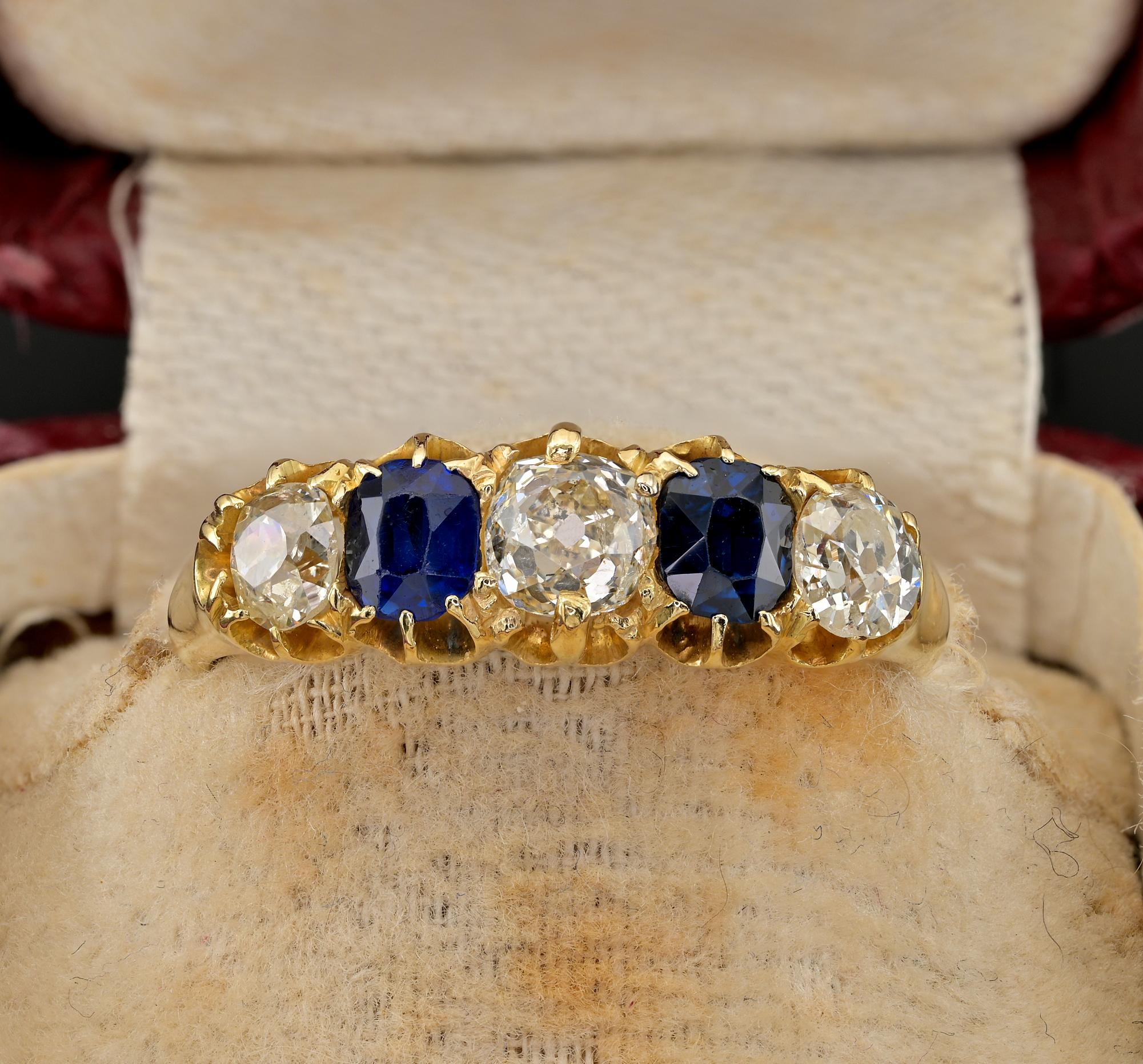 This gorgeous antique Victorian period ring is 1890 ca.
Traditional five stone setting hand crafted of solid 18 Kt gold, stamped
Setting comprises a selection of 3  bright white old mine cut Diamonds 25 – .50 – .25 – G VS/SI
2 oval cushion cut