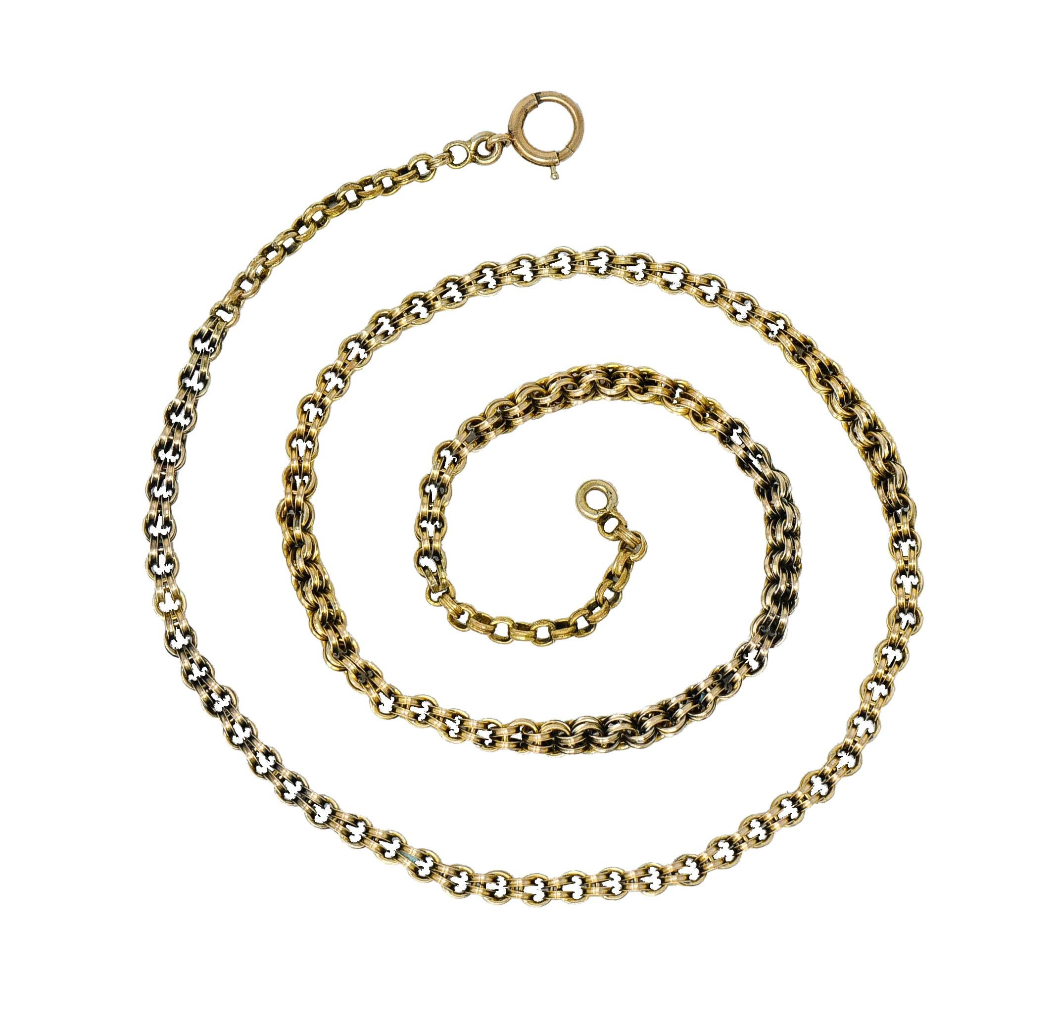 Victorian chain comprised of round ridged links intersecting perpendicularly

Completed by a spring ring clasp

Tested as 10 karat gold

Circa: 1890

Length: 17 inches

Width: 1/8 inch diameter

Total weight: 6.6 grams

Antique. Hand-Fabricated.