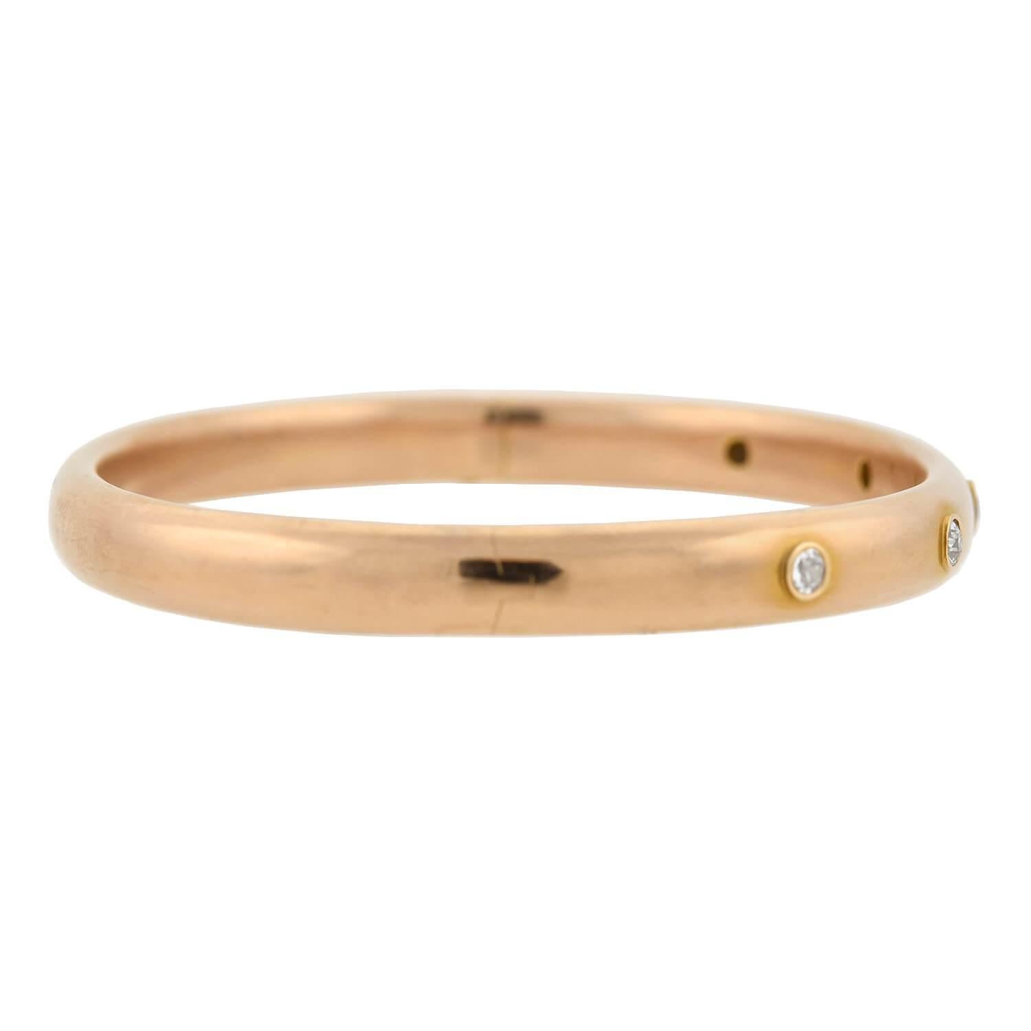 A stunning bangle bracelet from the Victorian (ca1880) era! Crafted in 14kt rose gold, this hinged bangle features five of sparkling old Mine Cut diamonds set across the front. The bezel set stones weigh approximately 1.00ctw combined, sparkling