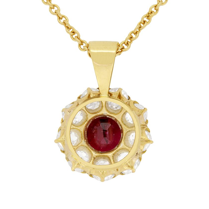 A deep red old cushion cut ruby is the centre of this gorgeous Victorian pendant. It is a 1.00 carat, and has been certified by the Gem and Pearl Laboratory as natural, unheated, and of Burmese origin. A halo of 9 old cut diamonds surrounds the