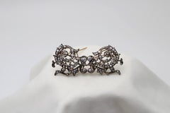 A Victorian 10.16 Old Mine & Old European Art Deco Silver & Gold Double Brooch