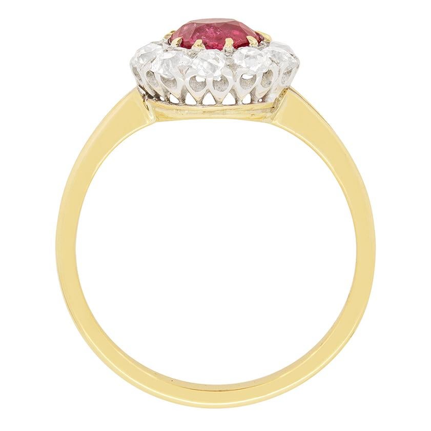 A gorgeous natural ruby is the star of this Victorian ring. It is 1.07 carat, and has been determined to be Burmese origin. A halo of old cut diamonds surround the ruby, and are graded as G colour and SI clarity. They total to 1.00 carat, adding