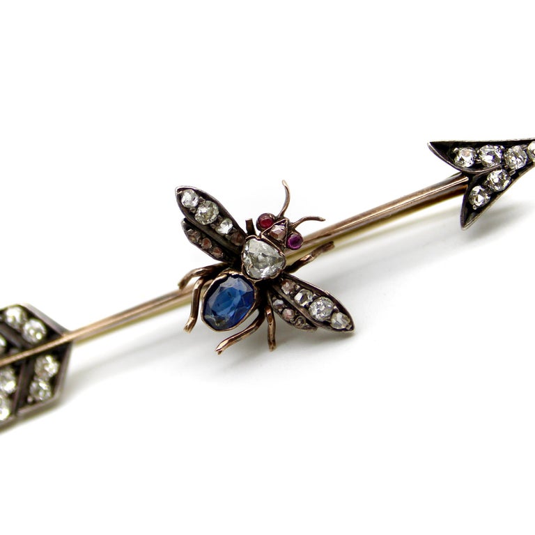 Old Mine Cut Victorian 10K Gold Diamond Ruby and Sapphire Fly and Arrow Brooch For Sale