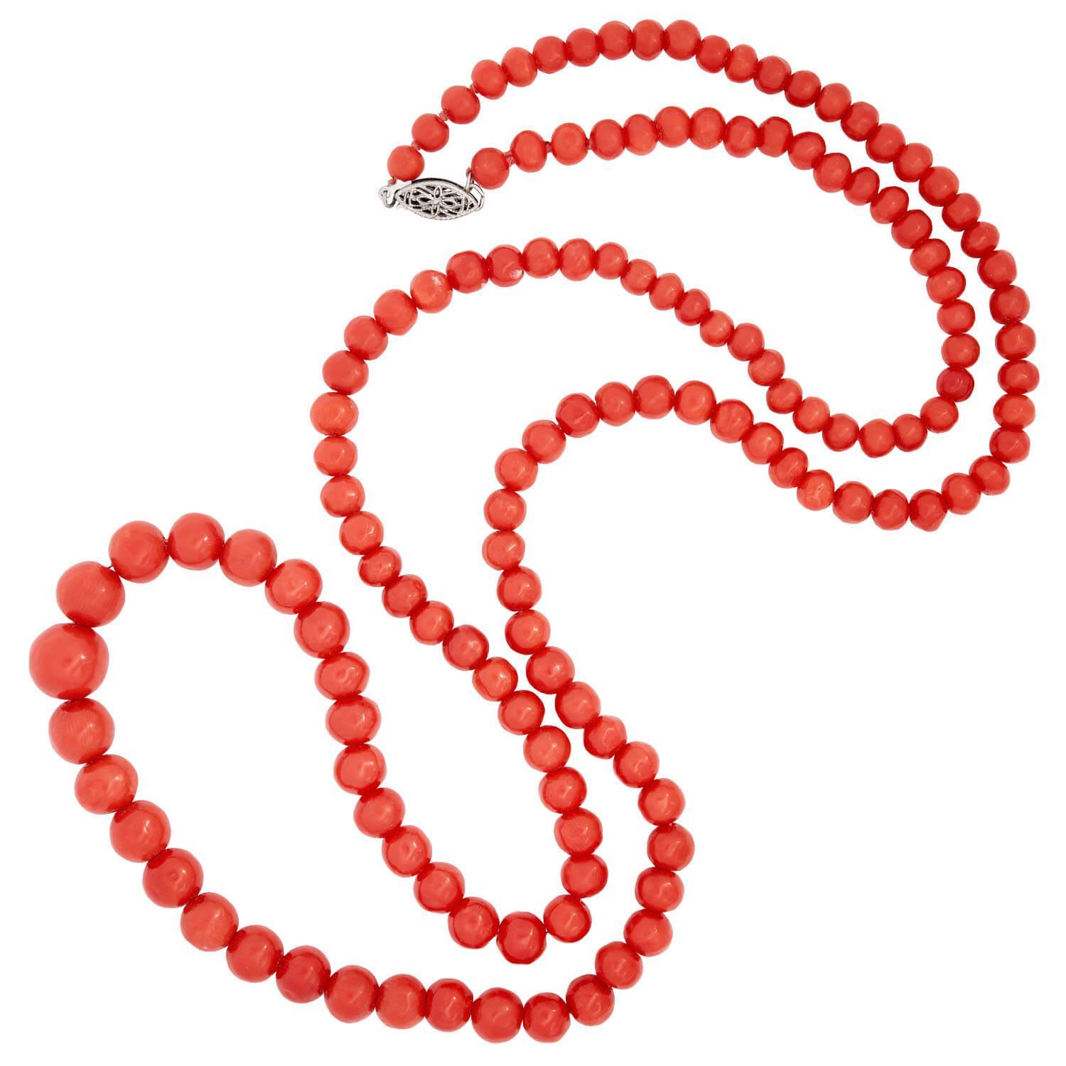 A gorgeous coral bead necklace from the Victorian (ca1880) era! This lovely necklace is comprised of a single strand of graduated coral beads, which are hand strung on light red thread. Each natural and undyed bead has a smoothly polished surface