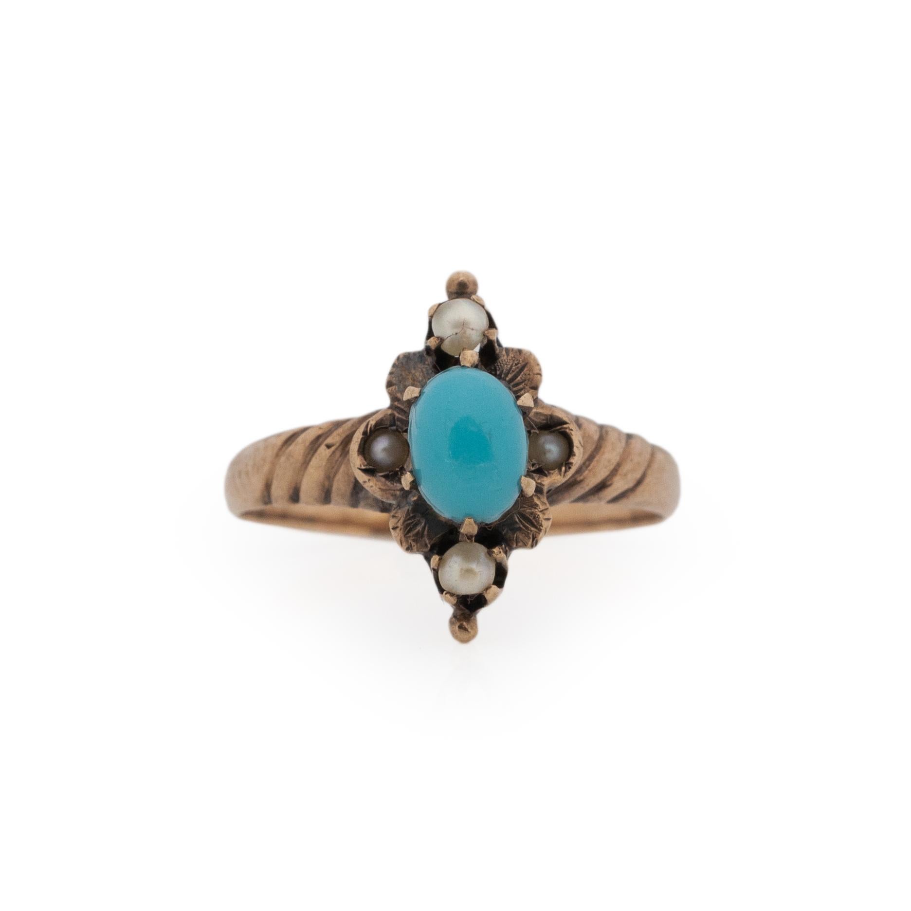 This Victorian stunner is a wonderful conversation piece. Hand crafted in 10K rose gold, this ring sits elongated on the finger. In a North South design, in the center of the floralesk shape is a smooth turquoise cabochon delicately held in by six