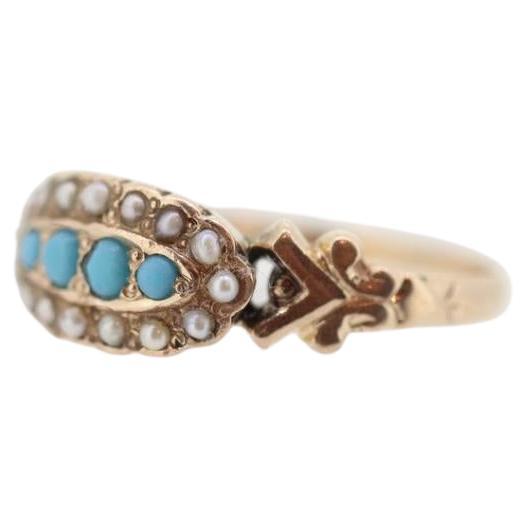Vintage from the 1900s
Materials: Gold
Gemstone: Turquoise
Gem color: Blue
Style: Minimalist
Beautiful Victorian Ring. Oval top with Turquoise and Pearl seed bezel set into a 10k Flower ornate shank.

Absolutely stunning.

Condition: Shows some