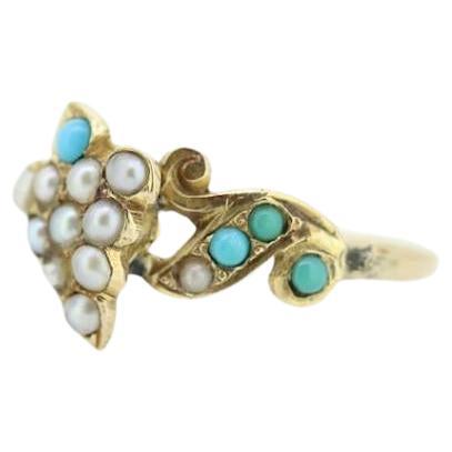 Vintage from the 1900s
Materials: Gold
Gemstone: Turquoise
Gem color: Blue
Style: Minimalist
Beautiful Victorian Ring. Vine top with Turquoise and Pearl seed bezel set into a 10k Flower ornate shank.

Absolutely stunning.

Condition: Shows some