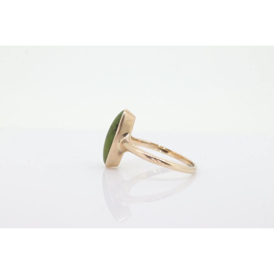 Vintage from the 1920s
Size: 5 1/4 US
Materials: Gold
Gemstone: Turquoise
Gem color: Green

Style: Minimalist

Beautiful Victorian Ring. Oval Turquoise bezel set into a 10k smooth shank.

Absolutely stunning.

Condition: Shows some signs of use.