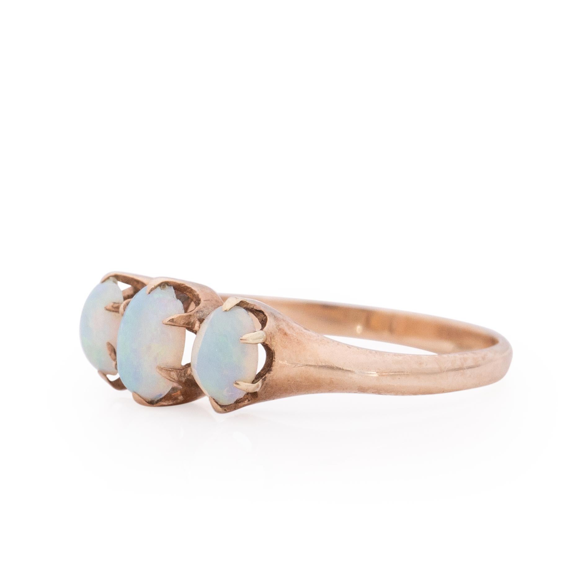 Three stone rings are a personal favorite. This Victorian one is a exceptional example. The fire in the three opals that sit in the 10K yellow gold mount is unbelievable. The flashes of blue and green, with the occasional pink is a perfect pop to