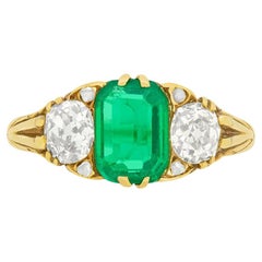 Victorian 1.10 Carat Emerald and Diamond Three-Stone Ring, circa 1880s