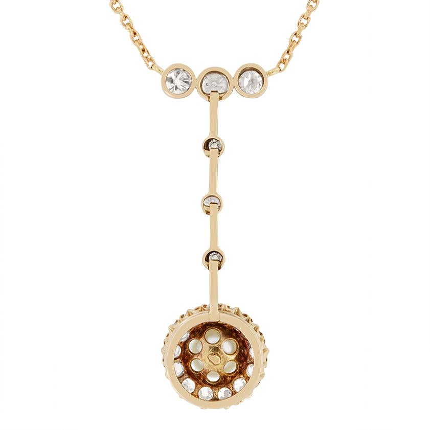 This exquisite Victorian necklace is crafted from 15 carat rose gold and held on a 14.5 inch chain. Three rub-over set old cut diamonds are set in a row, with the central diamond weighing 0.15ct, and the two at either end weighing 0.10cts each.