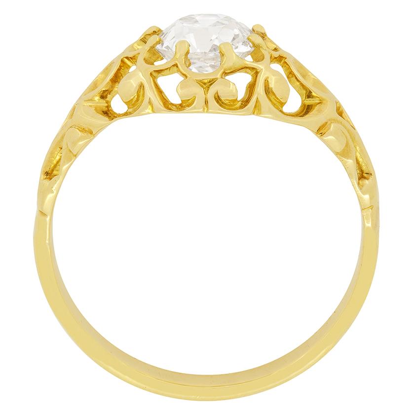 A distinguished Victorian ring with a 1.20 carat old cushion cut diamond as the focal point. The diamond has been estimated as H in colour, VS1 in clarity and is being held in the setting by eight refined claws. The gold has been decoratively formed