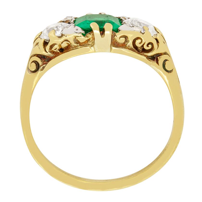 This beautiful Victorian trilogy ring features a natural Columbian emerald as its centre piece. The 1.20 carat emerald cut stone is vividly green and set between two 0.50ct old cut diamonds that really help the emerald look its best. These two