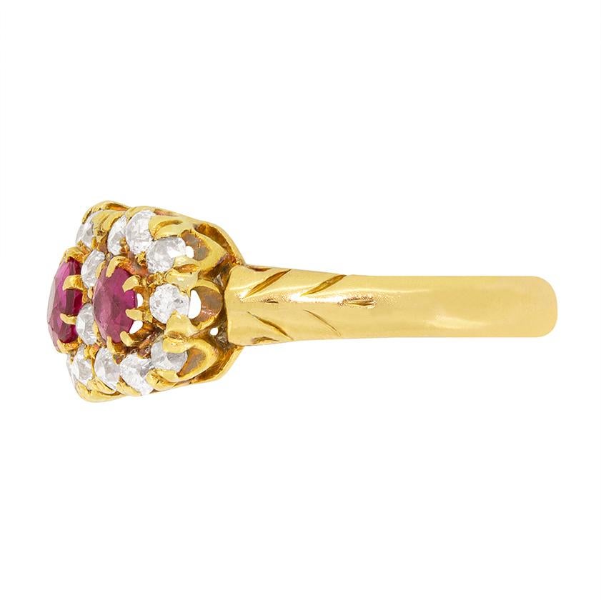 Three glorious diamond haloed rubies are on display in the beautiful ring from the Victorian era. The central Ruby is 0.50 carat with the two either side being 0.35 carat a piece. The diamonds which halo the rubies are all old cuts and total 1.20