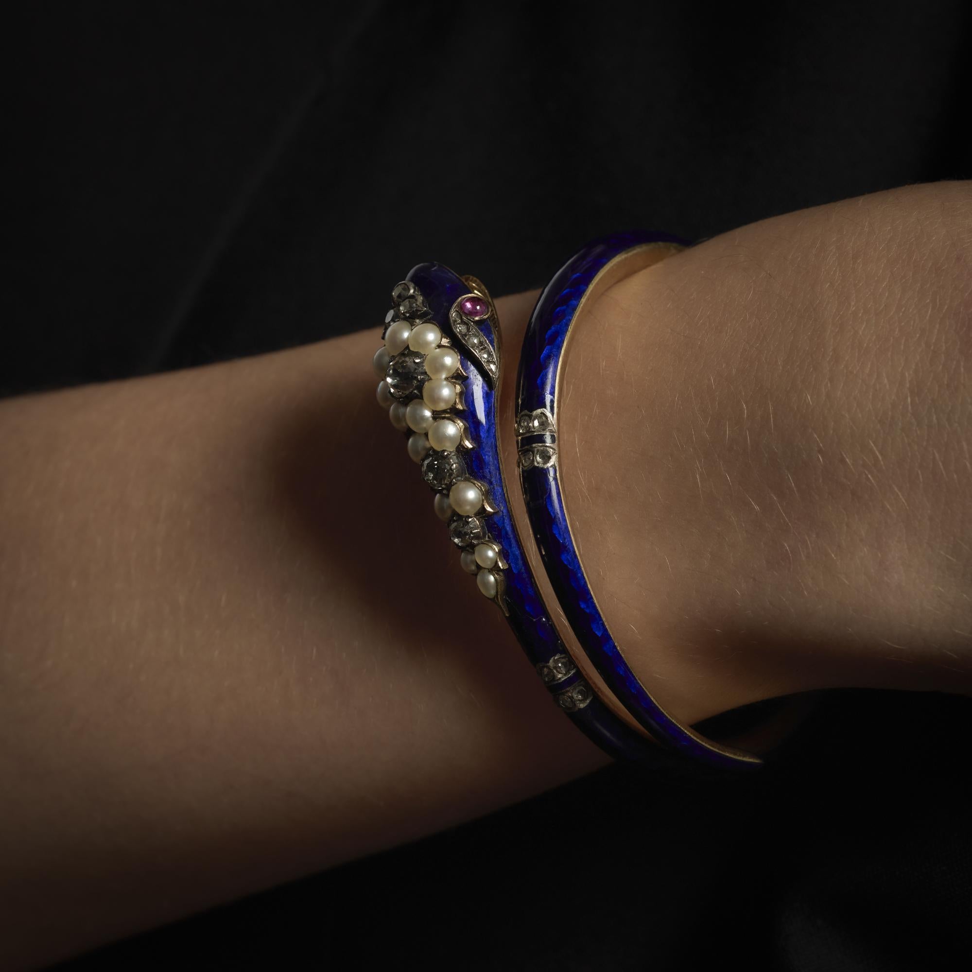 This Victorian bracelet from the 1880��’s combines the sparkle of six old European cut and twenty-two rose cut diamonds, totaling approximately 1.25 carats in J-K color and VS-SI clarity, with the rich red of two cabochon cut rubies weighing about .20
