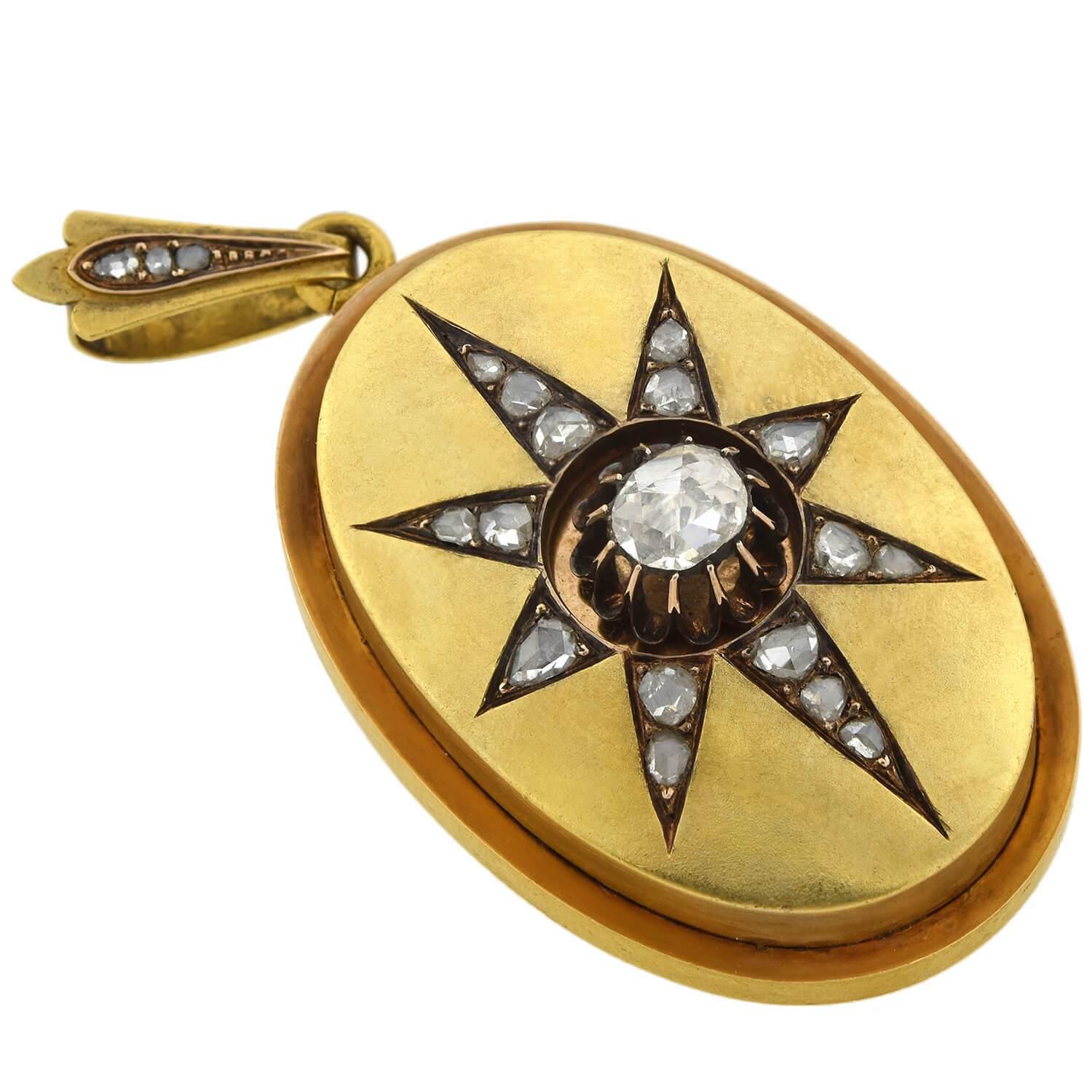An exquisite diamond starburst locket from the Victorian (ca1880) era! Crafted in 18kt yellow gold, this large, oval-shaped piece adorns a diamond encrusted starburst motif on the front. The sparkling old Rose Cut stones graduate outwards along the