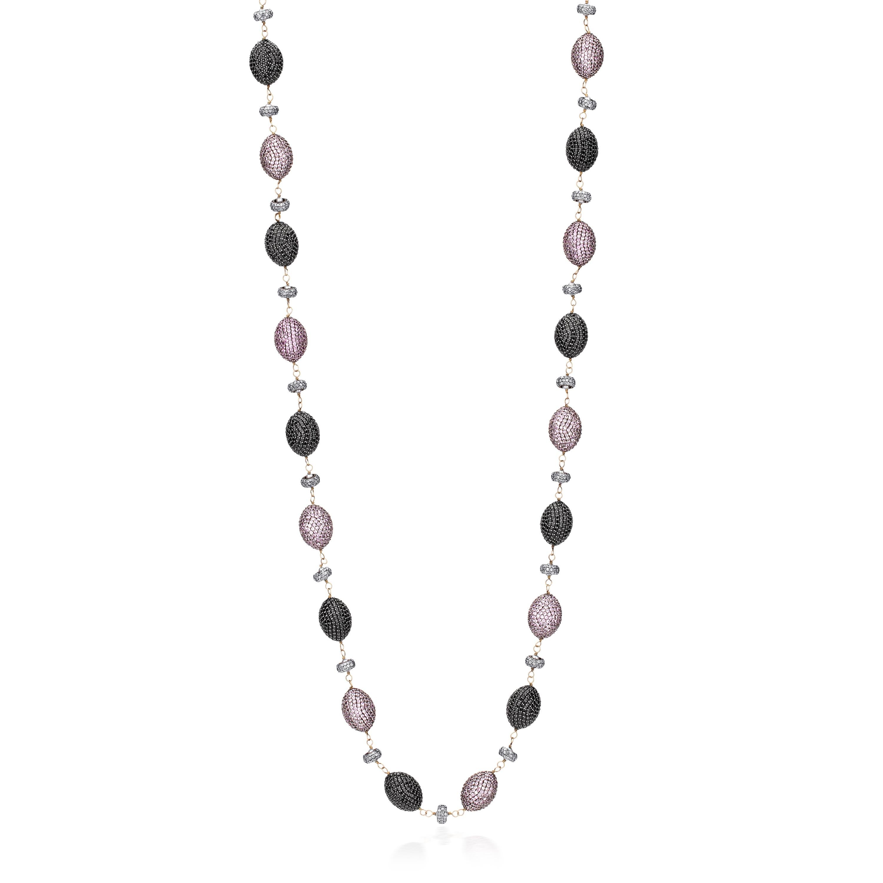 Lilac skies shine all day and night around with this fabulous Victorian station necklace crafted with oval-shaped beaded motifs of pink sapphire and black spinel alternating on a wire wrap chain. Each oval motif is separated with pearls caged in