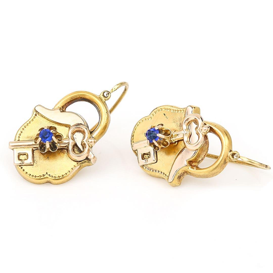 A super pair of 12ct yellow gold Victorian padlock and key earrings with small blue paste highlights. This rare and wonderful pair of antique Victorian earrings are loaded with symbolism with the padlock shaped as a love heart adorned with the