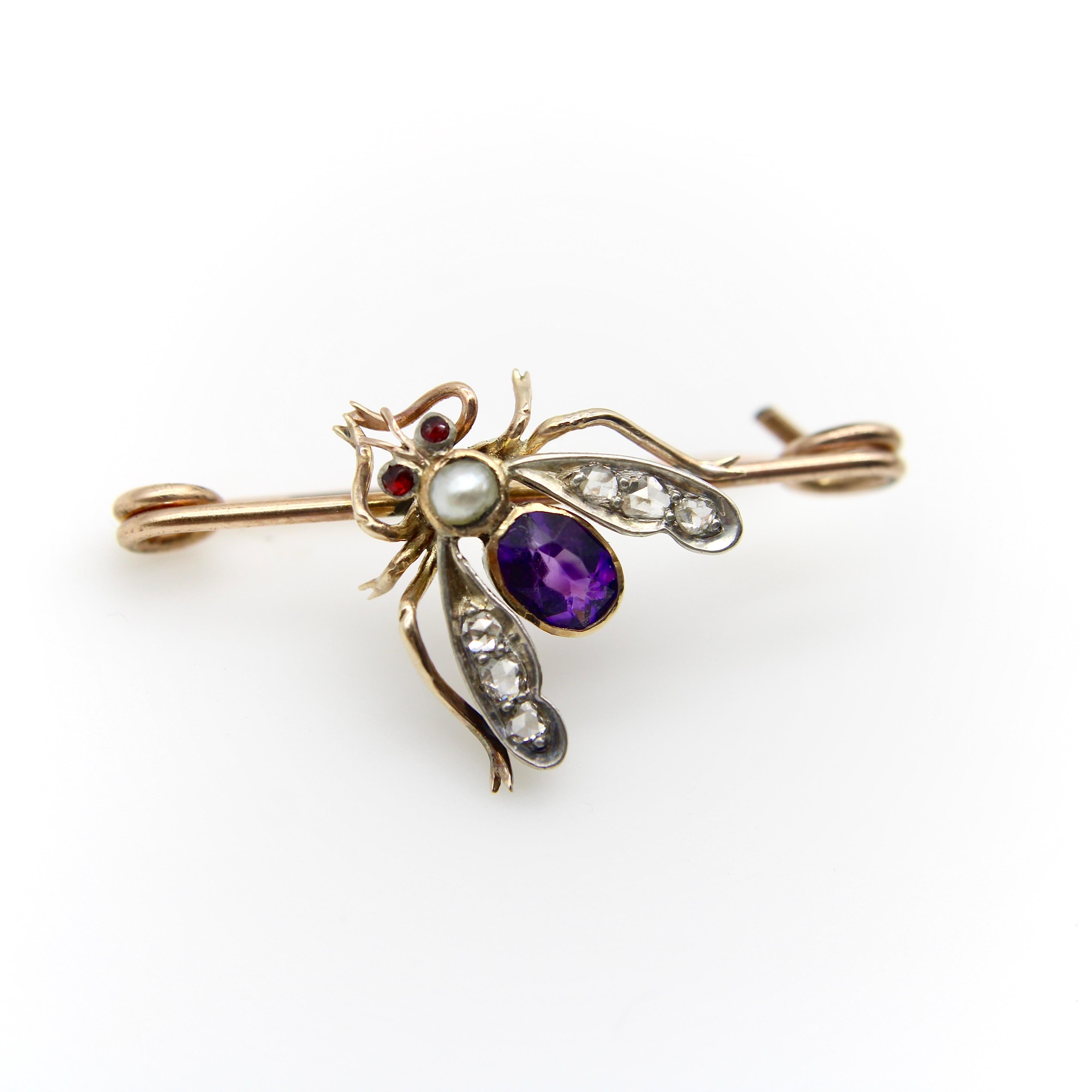 This 12k gold Victorian brooch is meticulously crafted with superb attention to detail. The adorable fly is jewel encrusted, with wings carved out to house beautiful Old Rose Cut diamonds while an amethyst and pearl make up the body of the fly. The