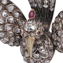 Victorian 12kt Gold and Silver Bird Brooch with Rose Cut Diamonds and Ruby Eyes