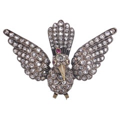 Victorian 12kt Gold and Silver Bird Brooch with Rose Cut Diamonds and Ruby Eyes