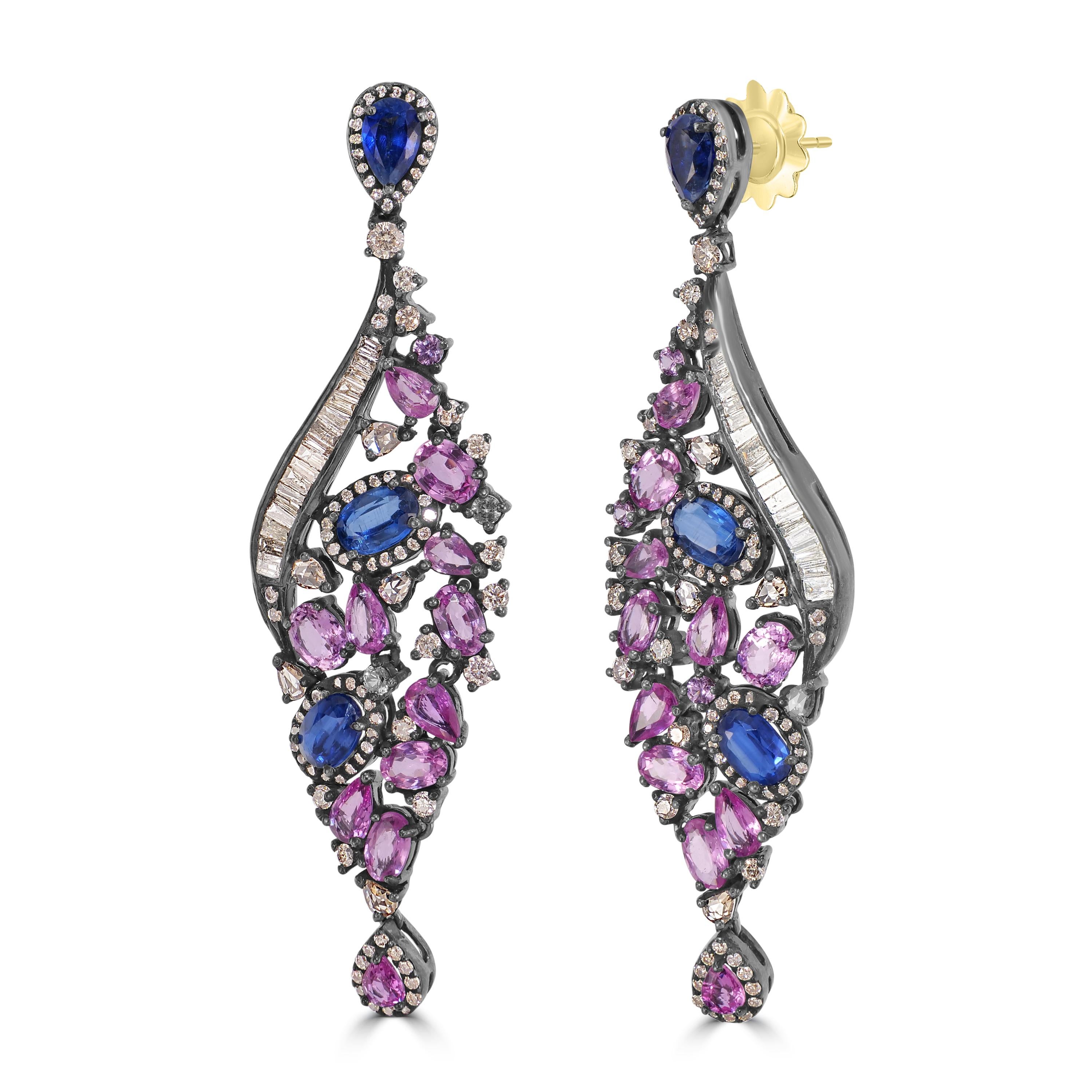 Introducing our Victorian 13.72 Cttw. Pink Sapphire, Kyanite, and Diamond Dangle Earrings – a captivating blend of elegance and sophistication.

At the pinnacle of these earrings sits a pear-shaped blue sapphire surmount, encased in a dazzling