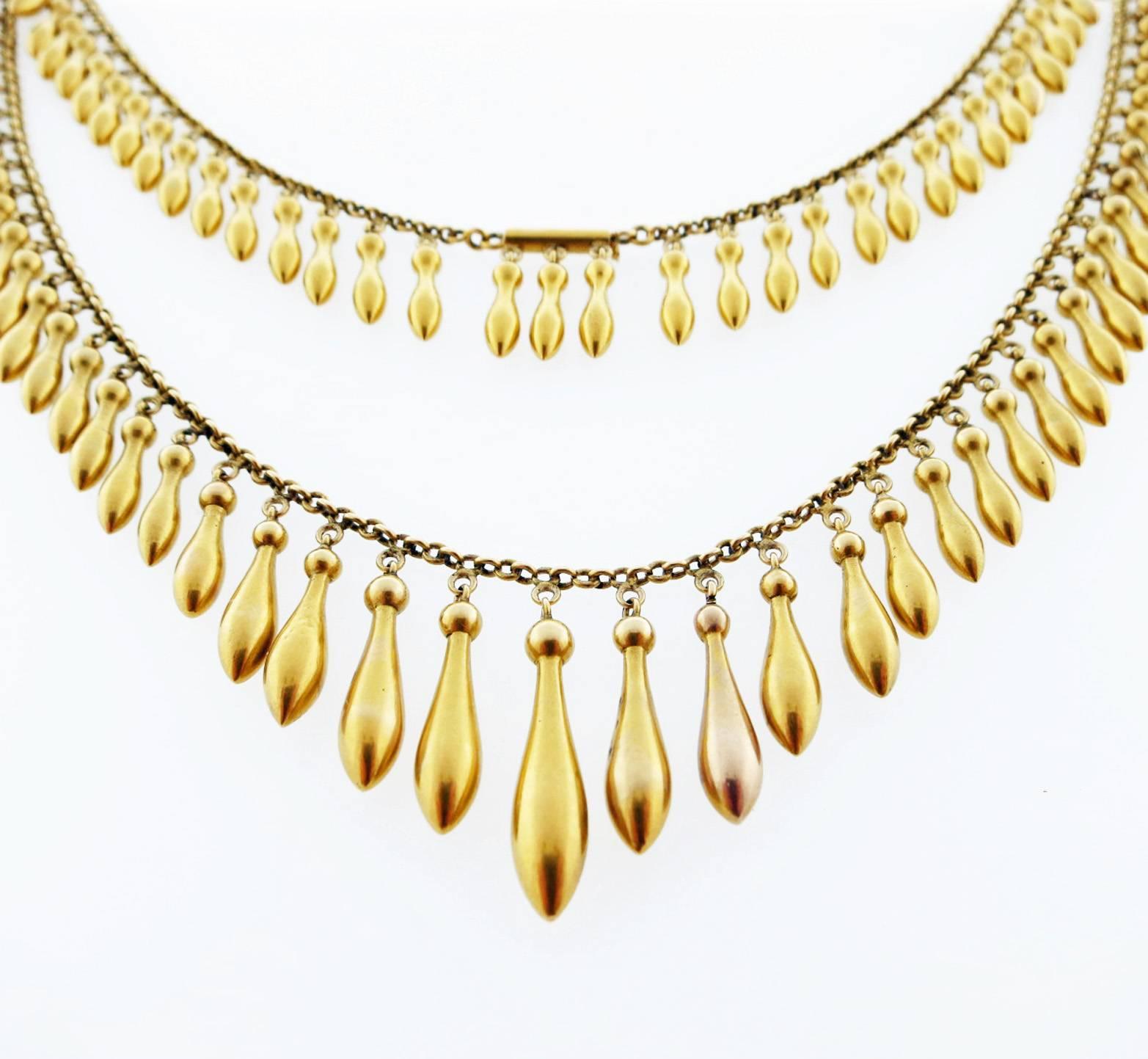  Antique lively and lovely  14kt. necklace measuring measuring 16 1/2 inches in length circa 1880. The necklace graduates gracefully around the neck of the wearer and has a hidden catch at the back.
