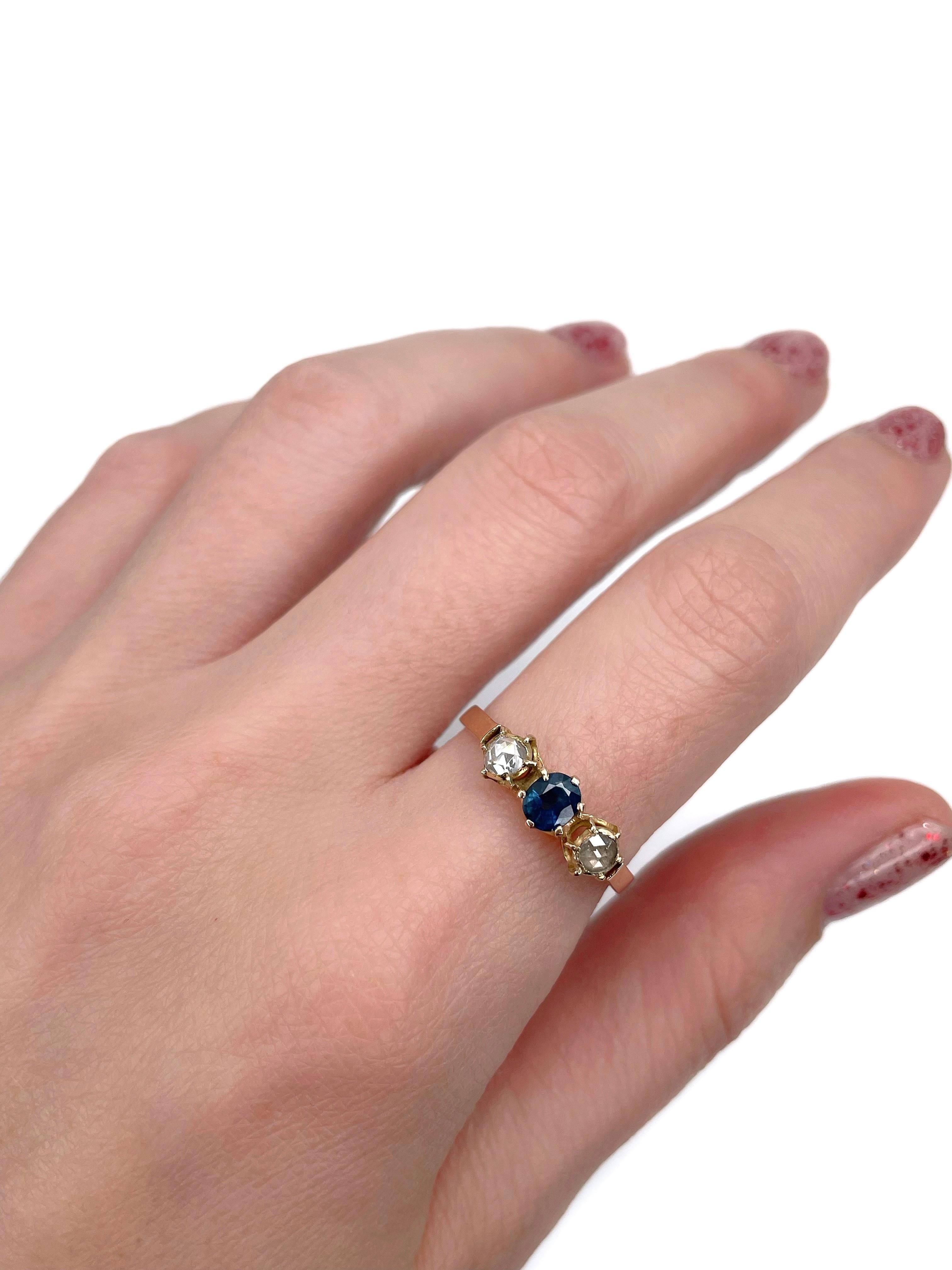 This is a Victorian three-stone ring crafted in 14K gold. Circa 1890. 

The piece features:
- 1 sapphire (oval cut, 0.35ct, B 6/3, P1)
- 2 diamonds (rose cut, TW 0.18ct, STW-TW, P1-P2)

Engraved “5 Juin 1893” inside the shank. 

Weight: 2.23g
Size: