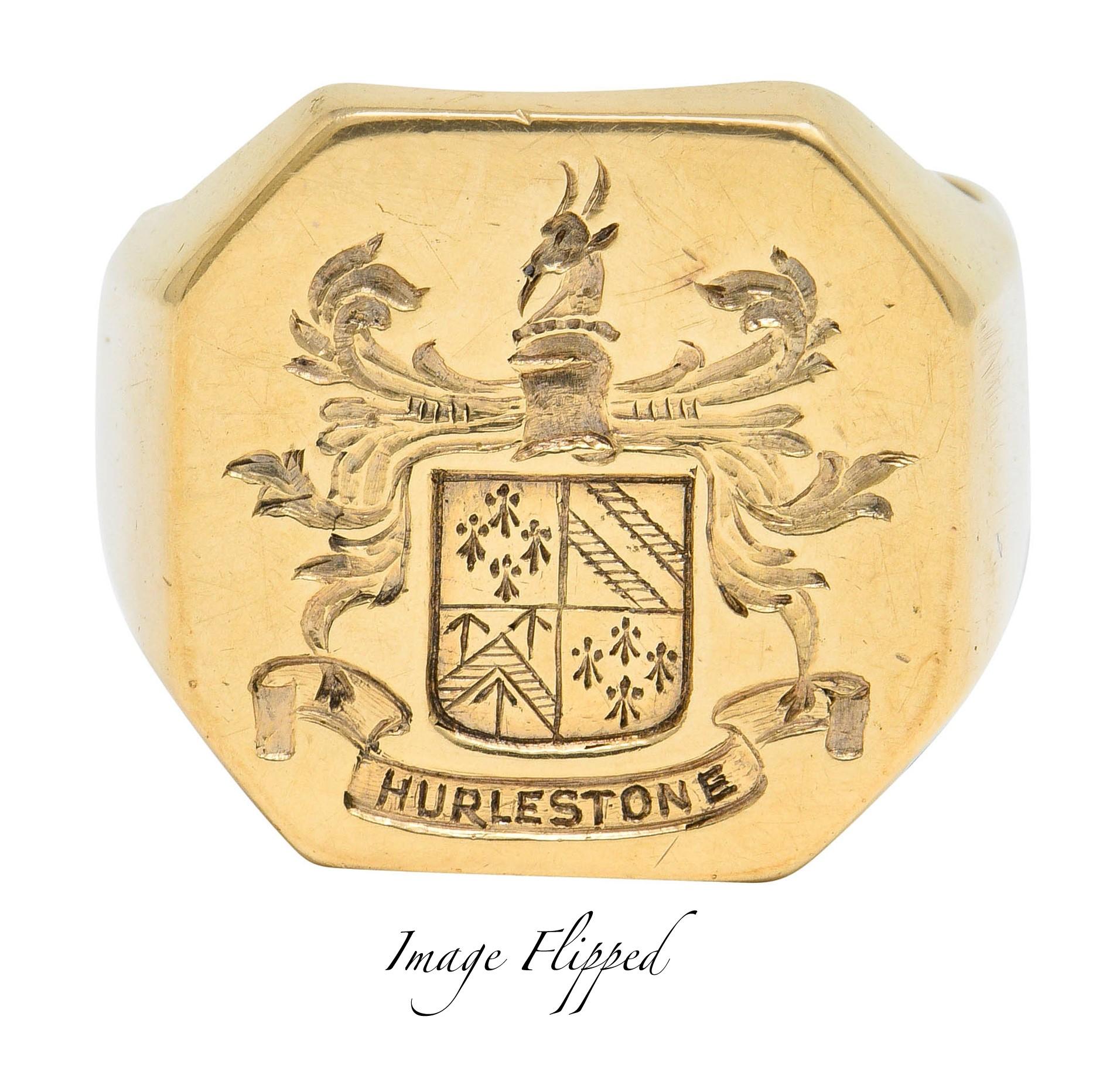 Signet style ring with an octagonal shaped face

Deeply engraved to depict a quadrisected shield surrounded by scrolling foliate

Topped by a stylized goat bust and with a scrolled banner inscribed 'HURLESTONE' in reverse

Stamped 14K for 14 karat