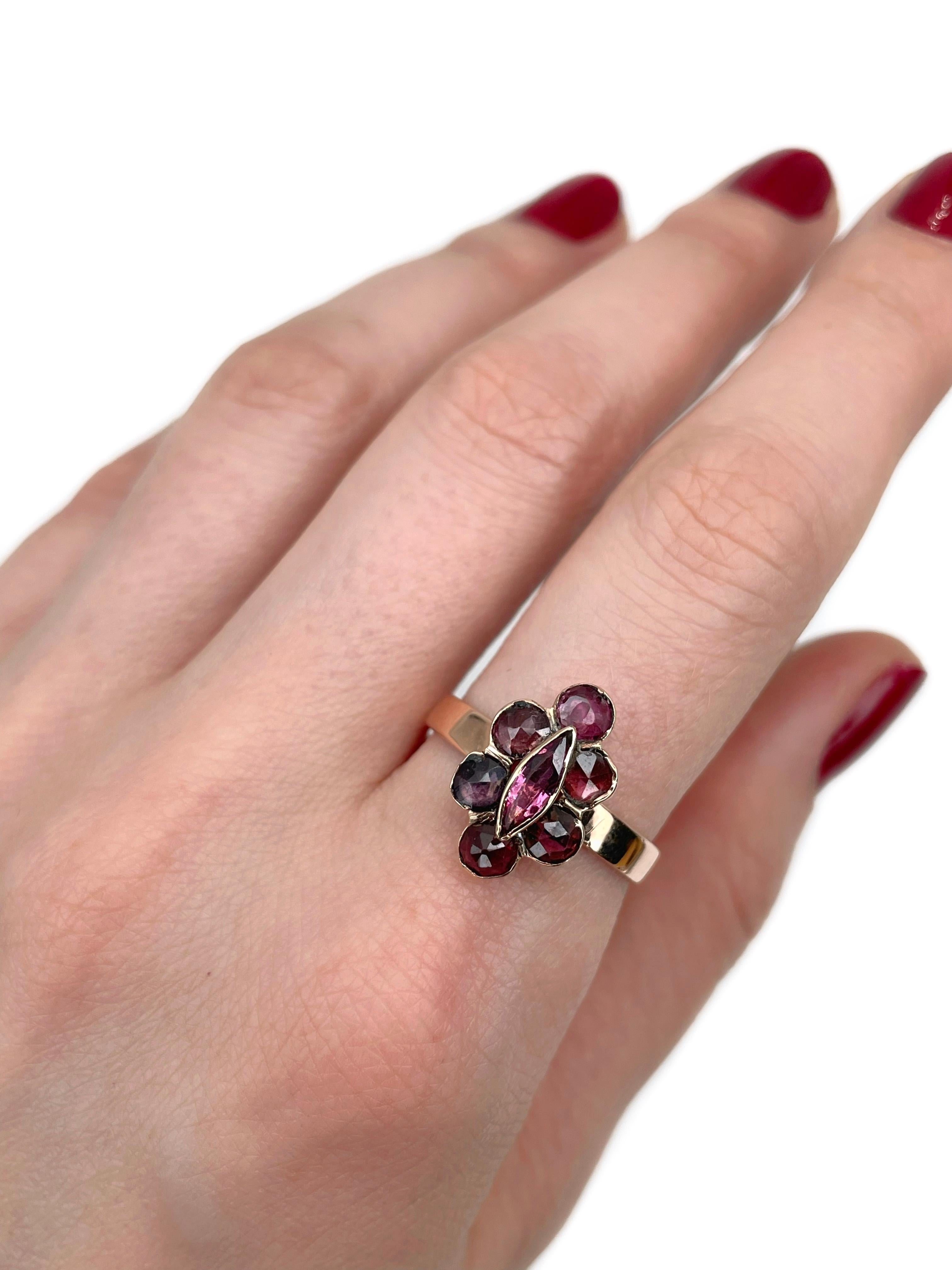 This is a Victorian navette ring crafted in 14K gold. The piece features rose cut garnets and ruby. Circa 1900. 

Weight: 3.32g
Size: 18.75 (US 8.75)

IMPORTANT: please ask about the possibility to resize before purchase. This process takes 2-7 days