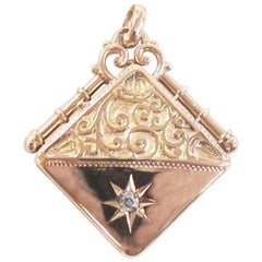 Victorian 14 Karat Rose Gold Repousse Locket with Old Mine Cut Diamond