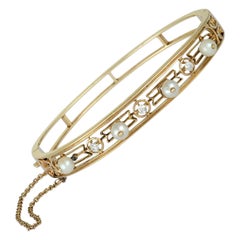 Victorian 14 Karat Yellow Gold 3-Diamond and 4-Pearl Bangle Bracelet Victorian 14 Karat Yellow Gold 3-Diamond and 4-Pearl Bangle Bracelet