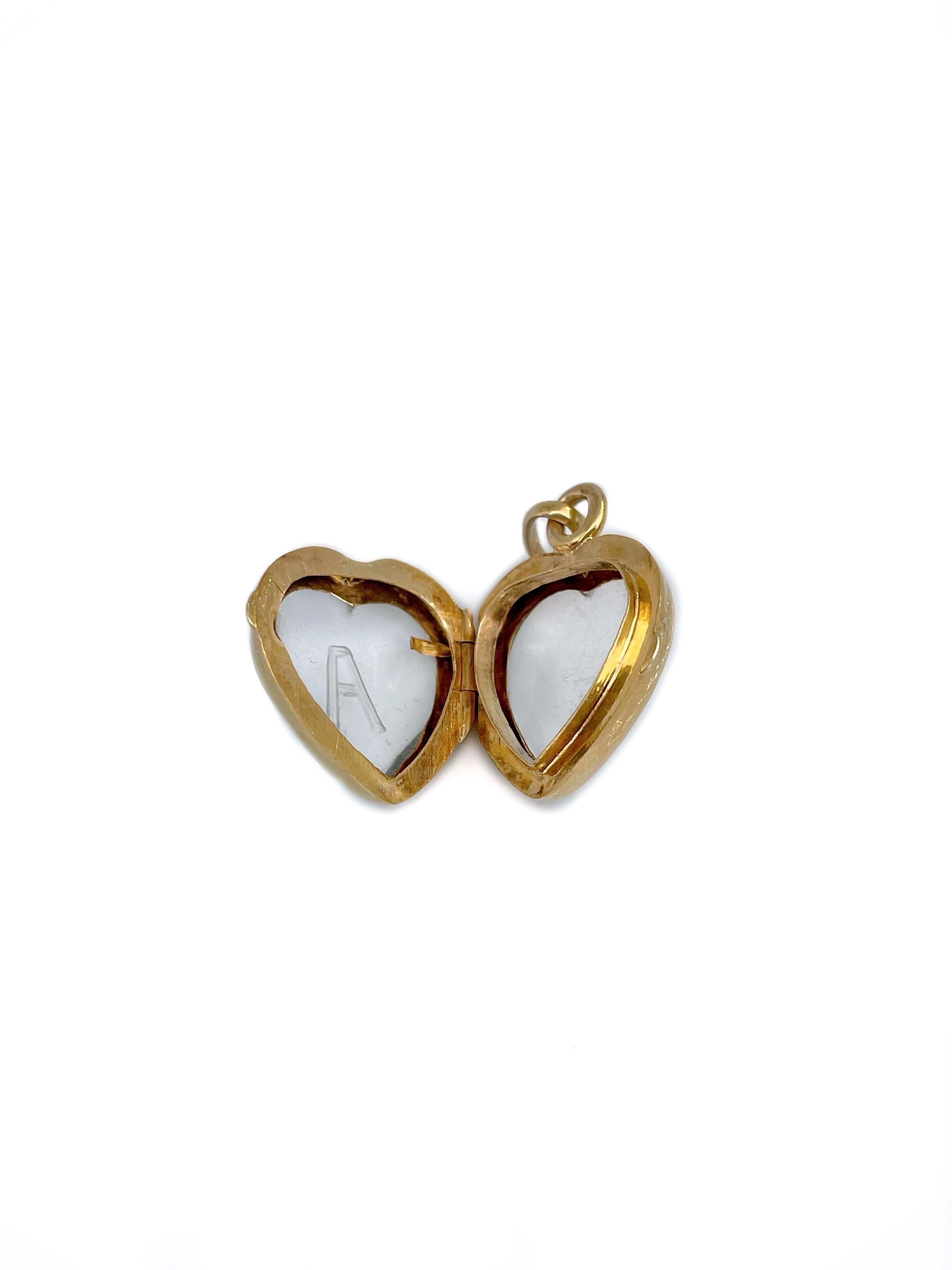 This is a delicate heart shape transparent locket pendant crafted in 14K yellow gold. Circa 1880. 

The piece is made of a rock crystal. Letter A is carved in the centre. 

The surface has scratches (can be seen in a video).

Weight: 3.38g
Size: