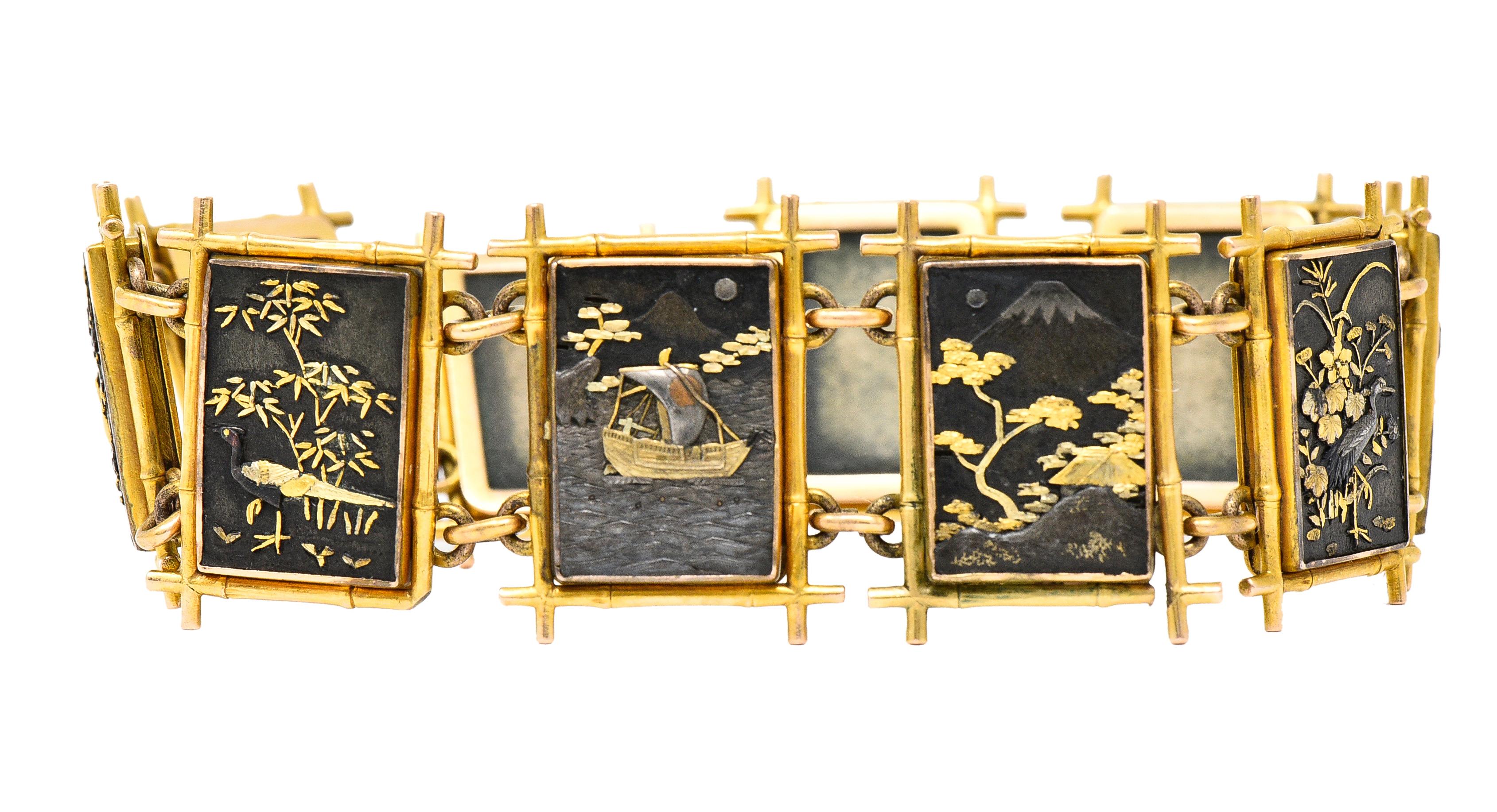 Designed as gold bamboo motif frame links each centering a shakudo panel. Depicting florals, birds, bamboo trees, a mountain and a ship at sea. Oxidized black silver with copper and gold accents. Connected via jump ring links. Completed by hidden