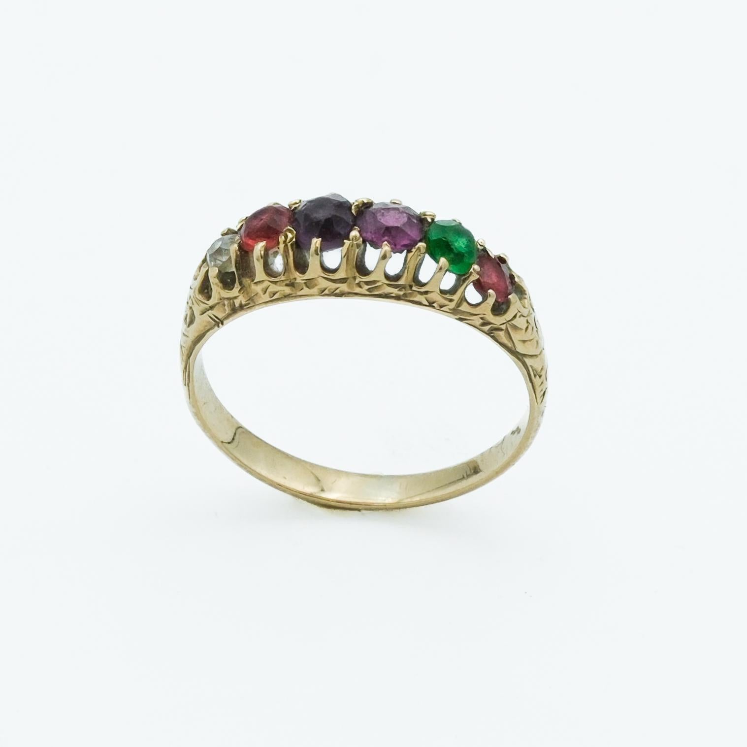 This 14 Karat yellow gold ring from the Victorian era is a distinctive example of acrostic jewelry, which was particularly beloved for its sentimentality. It features synthetic gemstones whose initial letters spell out the word 'REGARD' - Ruby,