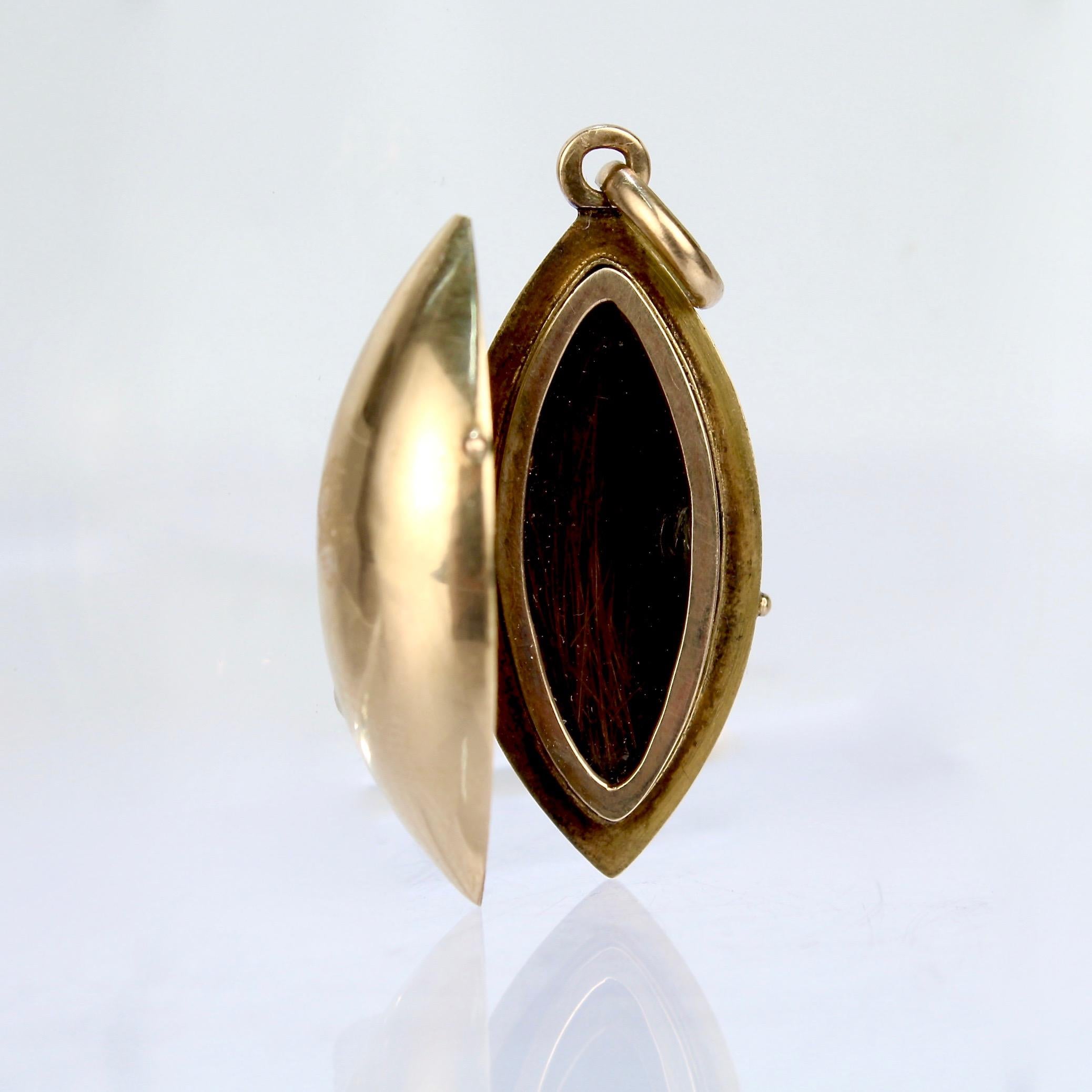 Victorian 14 Kart Gold and Black Enamel Mourning Pendant Locket with Hair In Good Condition For Sale In Philadelphia, PA