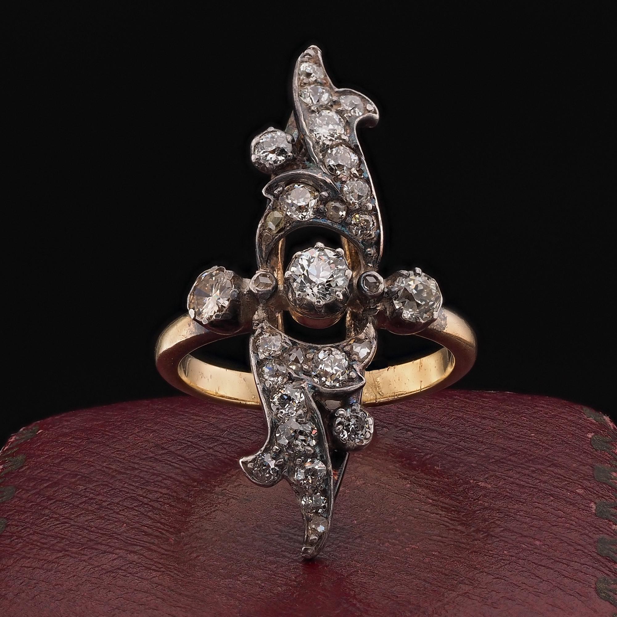 Victorian Statement Ring
Rare and very unique is this one of a kind Navette ring dating 1880 ca
Hand crafted of solid 18 Kt gold silver topped for the diamond housing
Bears French assay hallmark
Elaborate, elongated design which stands on finger to