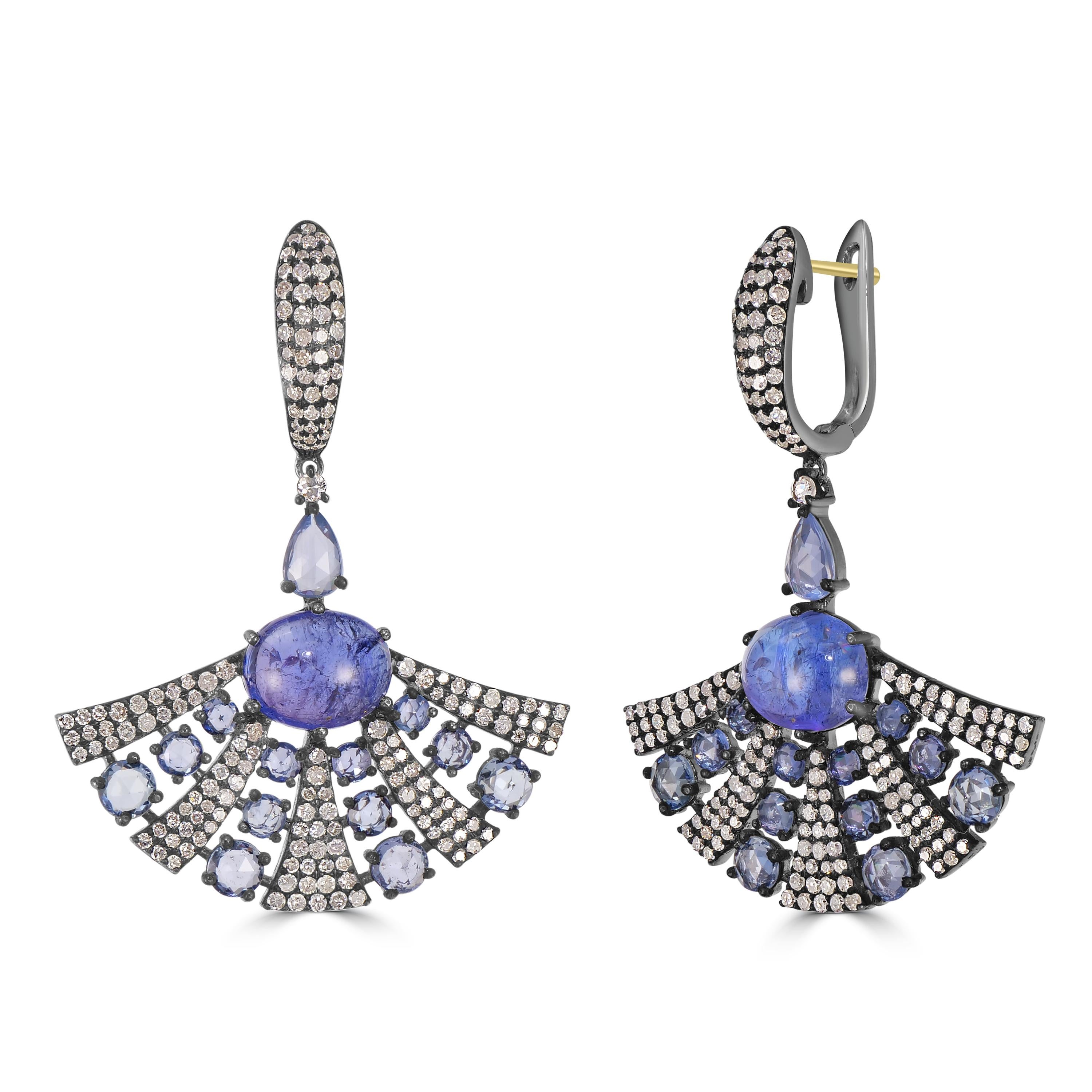 Immerse yourself in the allure of our Victorian 14.02 Cttw. Tanzanite, Blue Sapphire, and Diamond Dangle Arch Earrings—a masterpiece that marries sophistication with timeless beauty. The arch drop gracefully fans outwards, adorned with alternating
