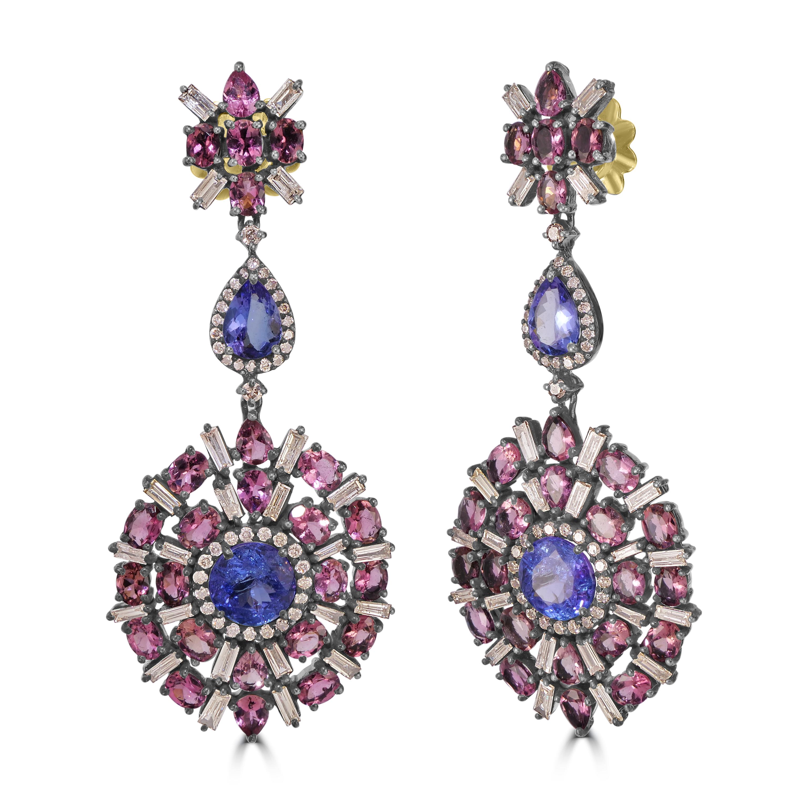 Indulge in the allure of timeless sophistication with our Victorian 14.54 Cttw. Tanzanite, Tourmaline, and Diamond Dangle Earrings, a captivating expression of refined craftsmanship and exquisite gemstones.

The circular drop at the heart of these