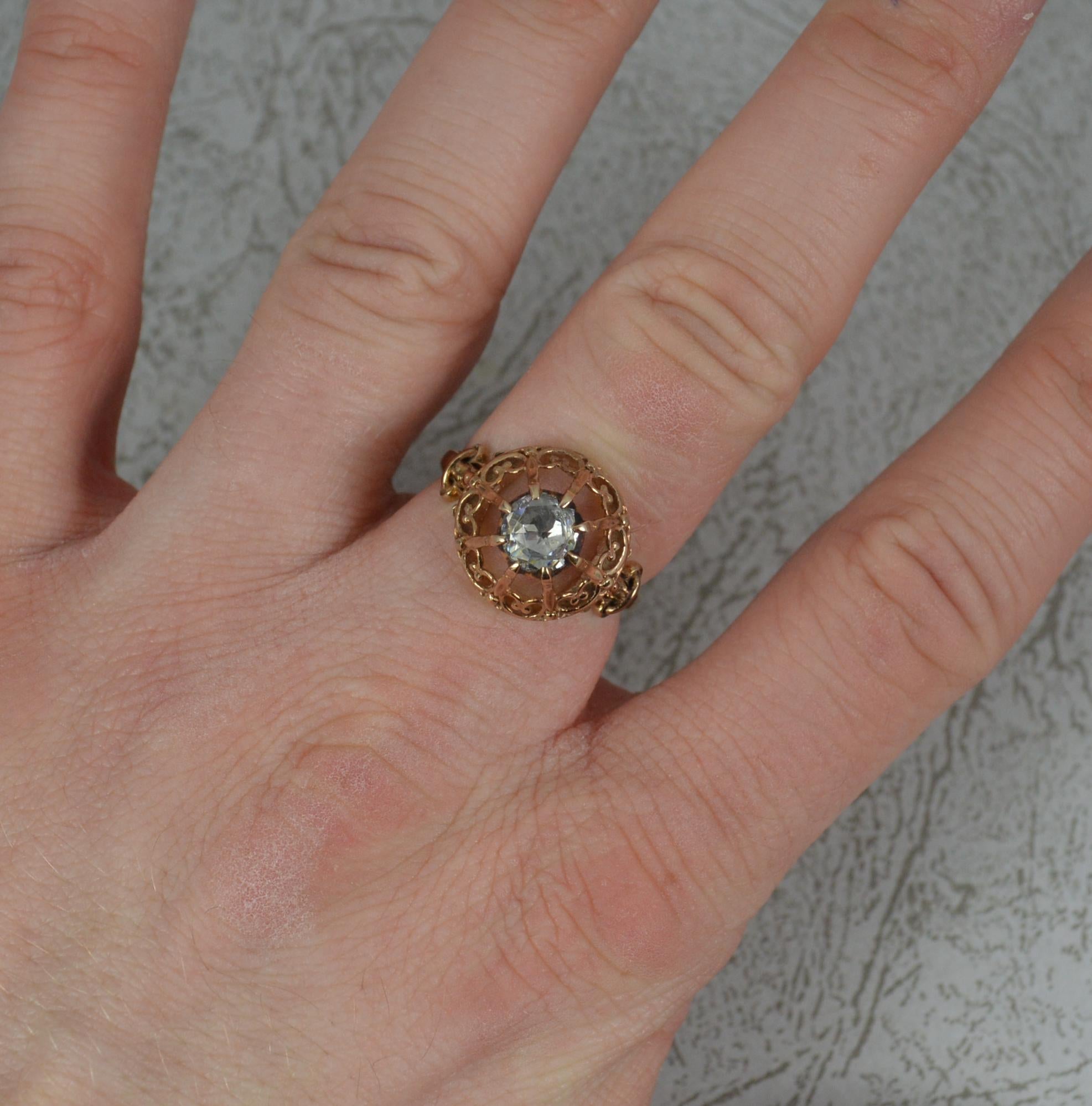 A superb late Victorian period ring.
Solid 14 carat rose gold example.
Set with a single natural, rose cut diamond, 5.8mm diameter, to spread approx 0.8 carats. Set into a closed, foiled, silver bezel setting.
Protruding 9mm off the