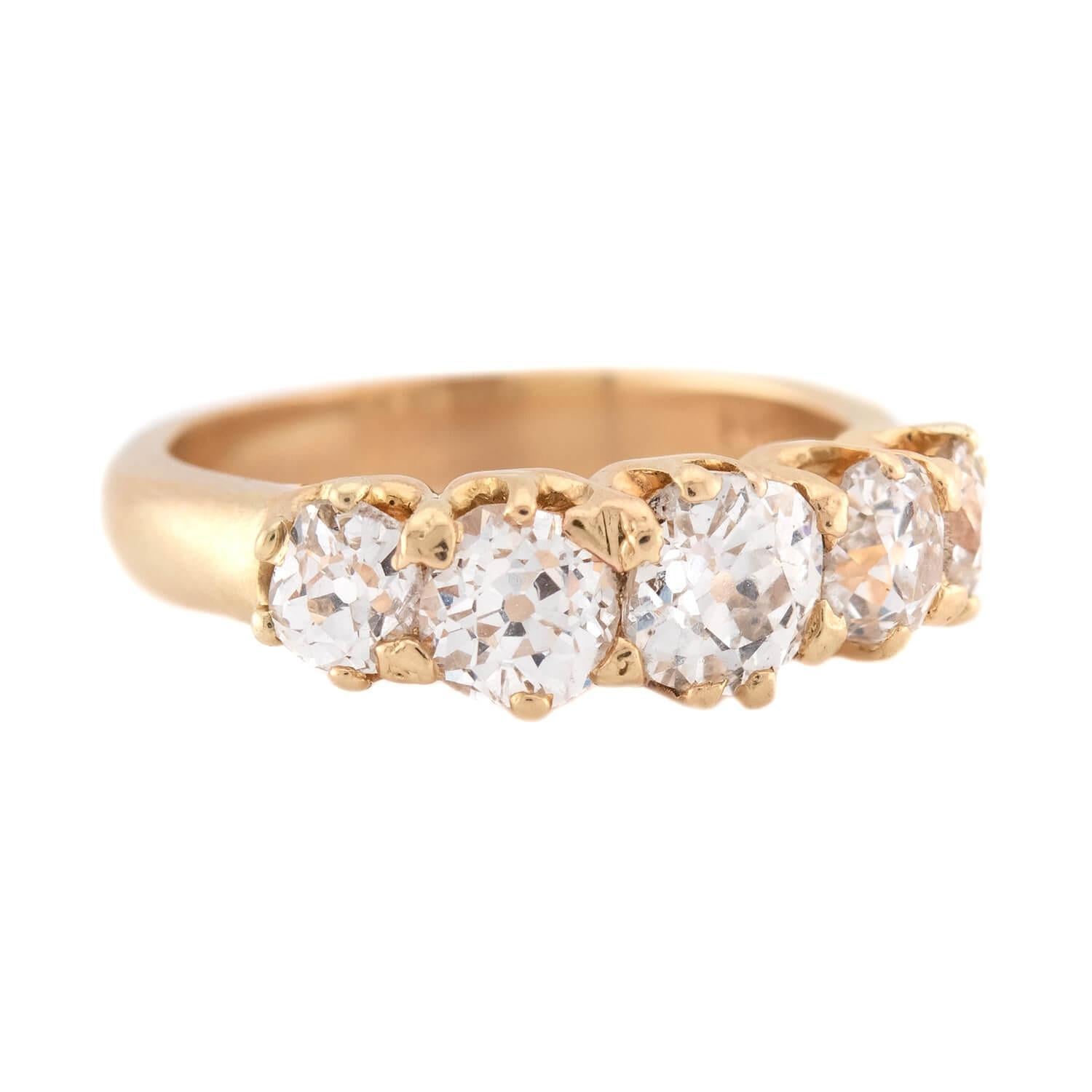 A gorgeous diamond ring from the Victorian era (ca1880s)! Crafted in vibrant 14k yellow gold, this stunning ring displays a row of five old European cut diamonds. The graduated stones are all prong-set, and have an approximate total carat weight of