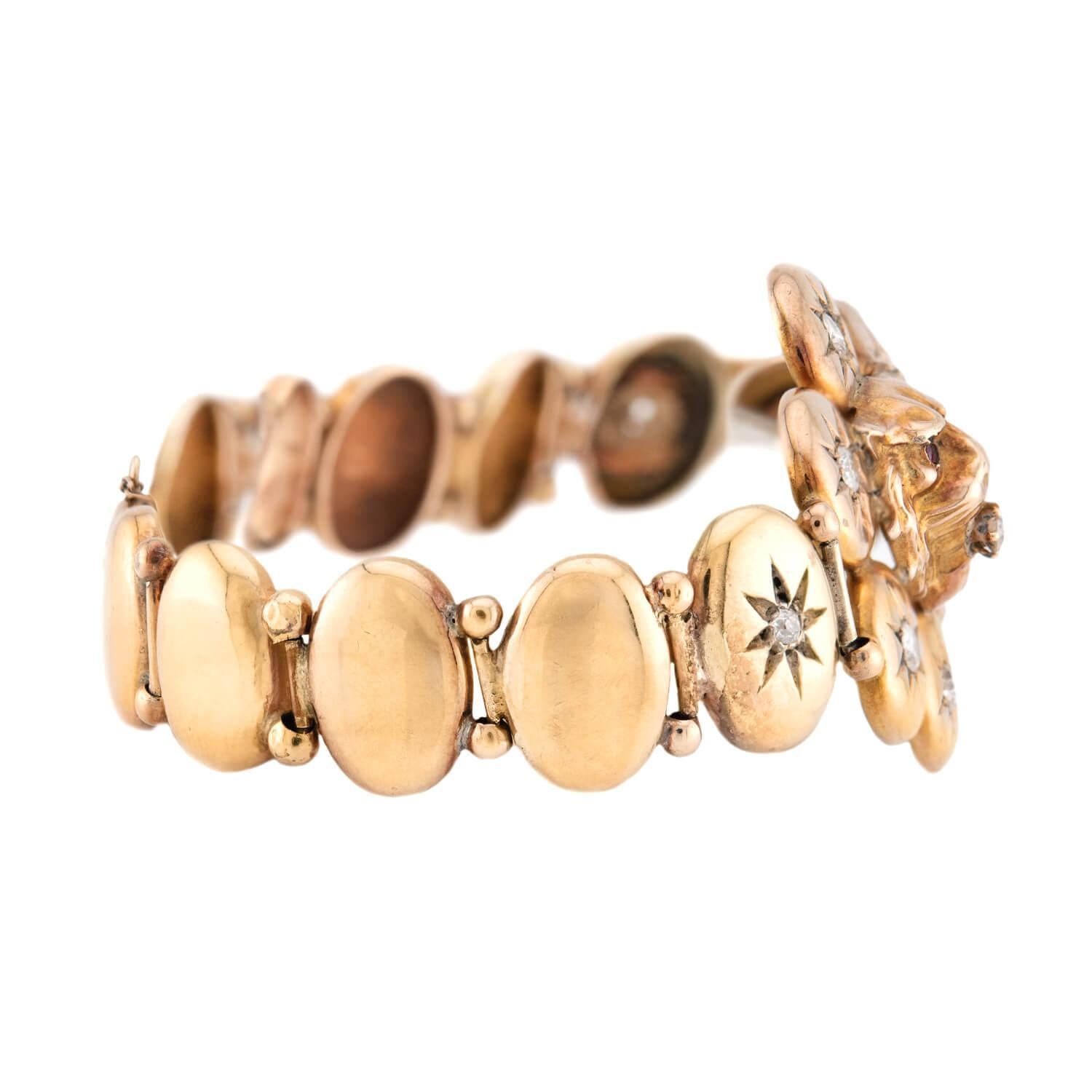A beautiful Lion bracelet from the Victorian (ca1880) era! The piece, which is known as a button bracelet, is comprised of oval/round shaped links with 8 links having mine cut diamond set in center with star motif cutout. The bracelet is crafted in