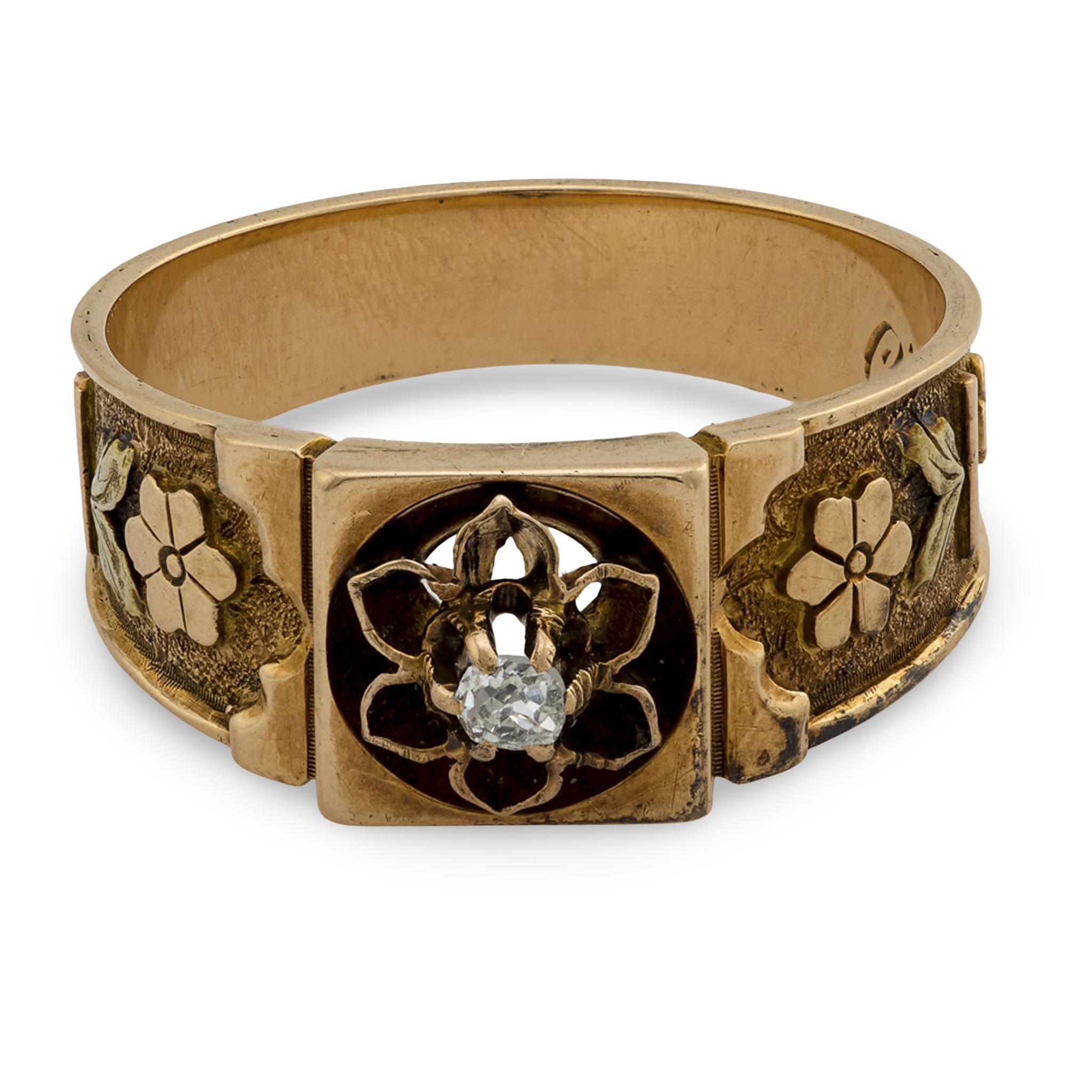 A beautiful diamond ring from the Victorian (ca1880s) era! Crafted in 14k yellow and rose gold, the center of this ring features a .08ct old mine cut diamond, which is held within a six-prong setting. The diamond rests atop a raised floral-motif