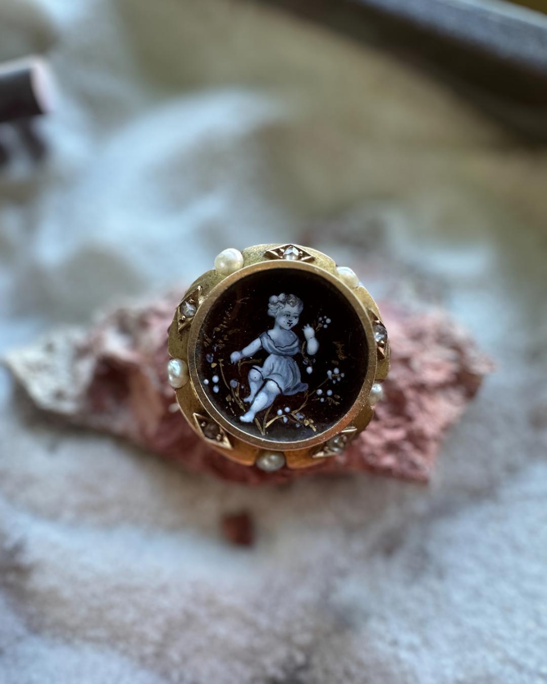 This exquisite Victorian pin features diamond, beautifully hand painted porcelain, and a delicate pearl. In good condition with minor surface wear, it exudes the elegant charm of the Victorian era. A stunning addition to any jewelry collection, with
