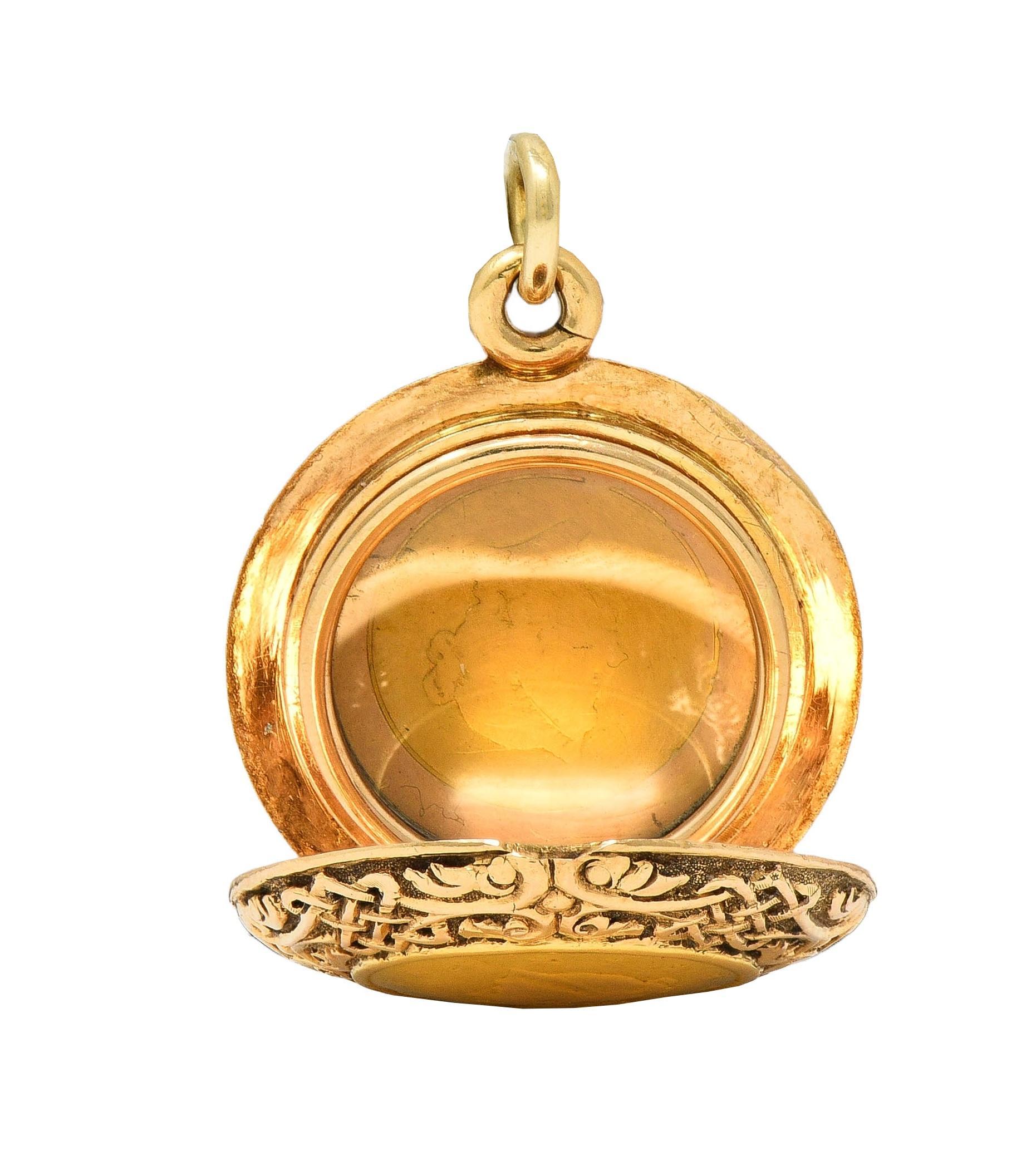 Designed as a round-shaped rose gold locket with a grooved Celtic knot motif throughout
Centering bezel set antique U.S. 22 karat gold coins on both sides
Coins are 1853 one-dollar coins depicting Lady Liberty on one side
Reverse is inscribed