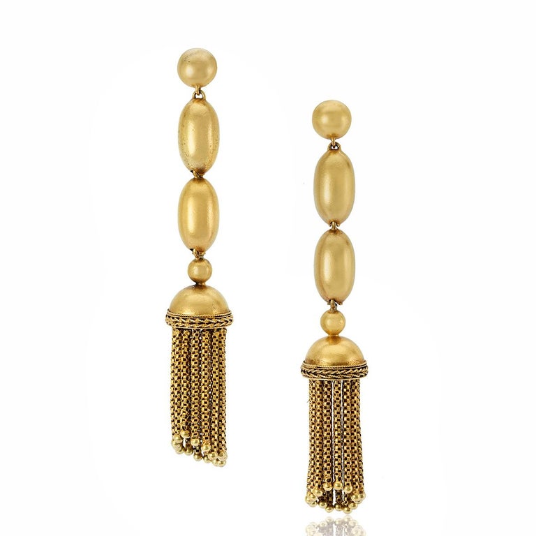 Victorian 14K yellow gold drop earrings comprised of two oval beads terminating in a tassel. These earrings have a beautiful finish to them and have a rich buttery satin glow. Circa 1870.