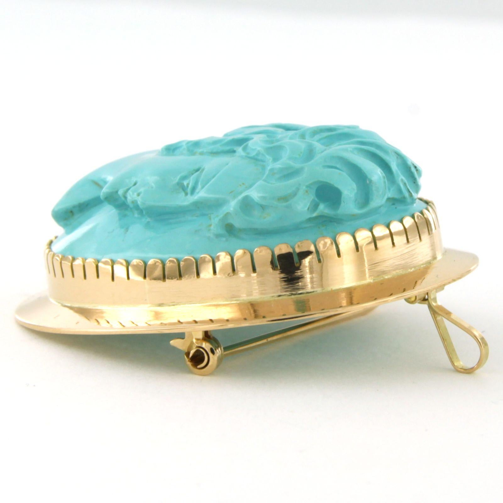 Victorian 14k yellow gold brooch/pendant with a turquoise cut in a woman's head - 20.6 grams  

detailed description:

the size of the brooch/pendant is in an oval shape of 4.7 cm long by 3.4 cm wide

weight 20.5 grams

set with

- 1 x 3.6 cm x 2.8