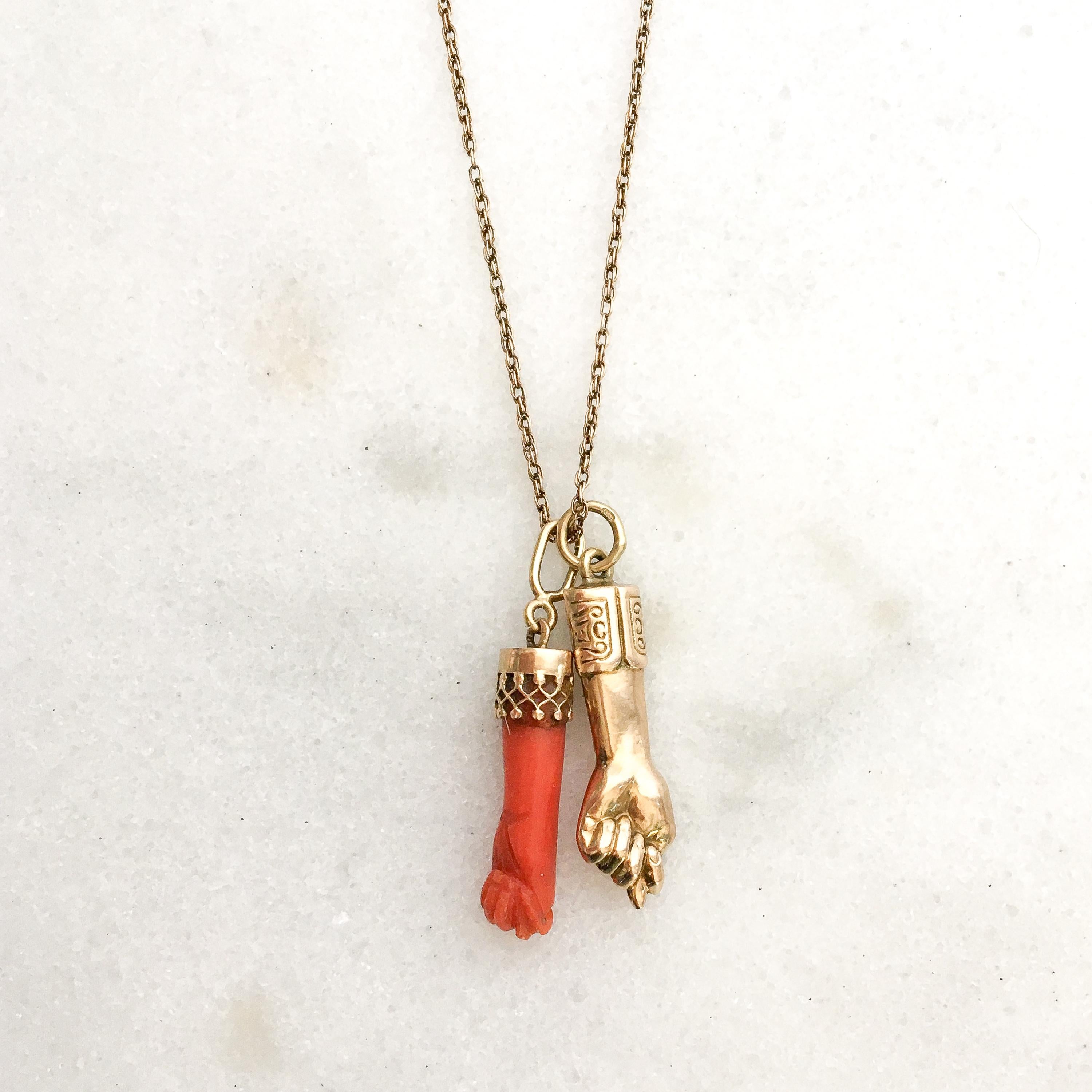 A Victorian red *coral figa hand charm set with a gorgeous 14 karat gold open-worked bail. The hand is beautifully detailed. The charm is great worn alone or layered with your other favorites. The charm comes without the necklace. 

The figa hand