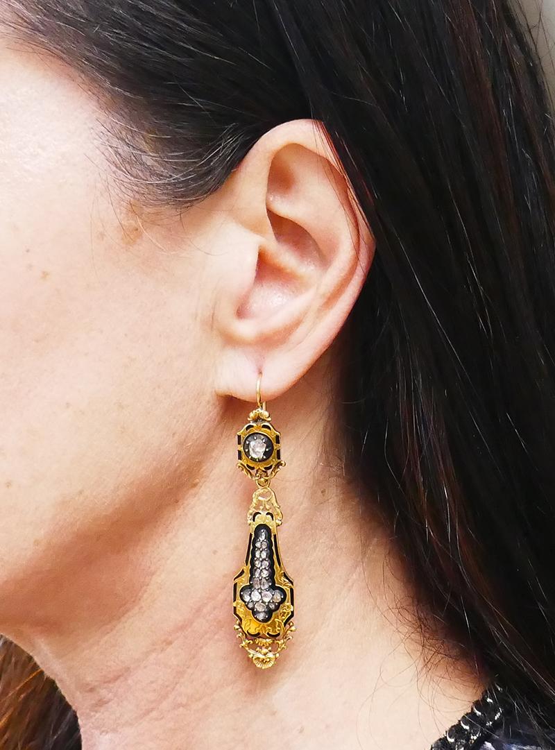 Beautiful Victorian earrings made of 14 karat (tested) yellow gold, black enamel and rose cut diamonds.
Measurements: 2 7/8” x 9/16”.
Weight: 11.2 grams.
